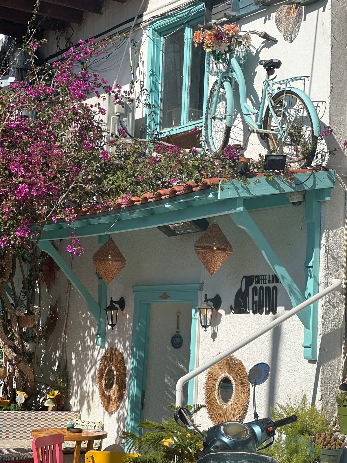 Tourist documents sunny Mediterranean coastal scenes in Kaş, Turkey