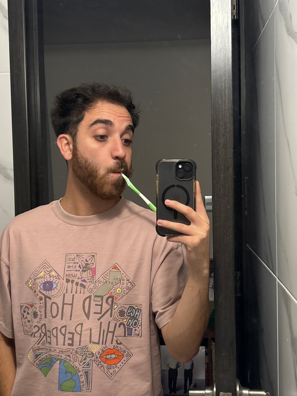 Man takes bathroom selfie while brushing teeth in Mexico