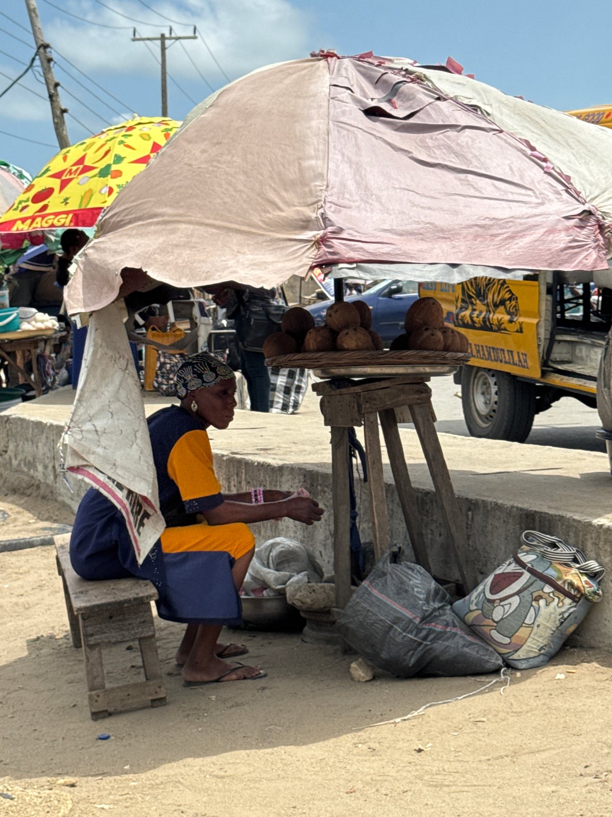 Street food vendors serve customers from makeshift stalls in Ajara