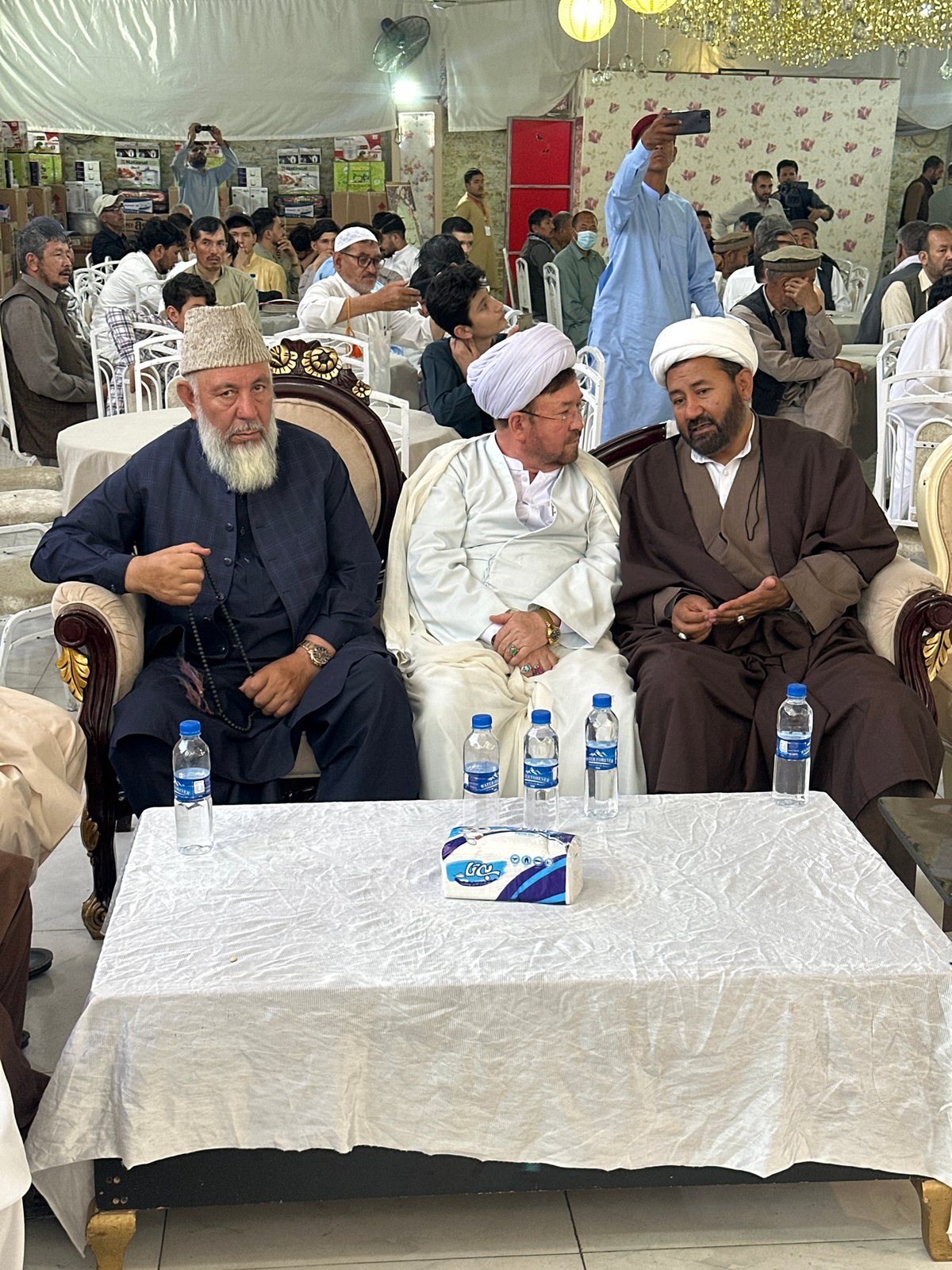 Traditional gathering of men in formal attire, Quetta