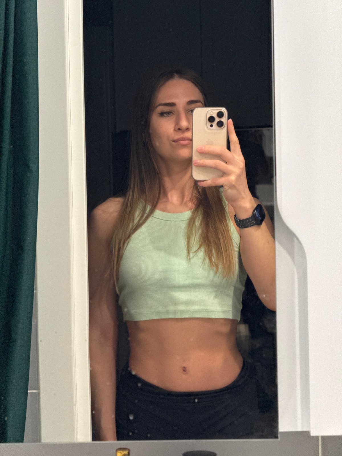 Woman takes mirror selfies in Lyubertsy bathroom