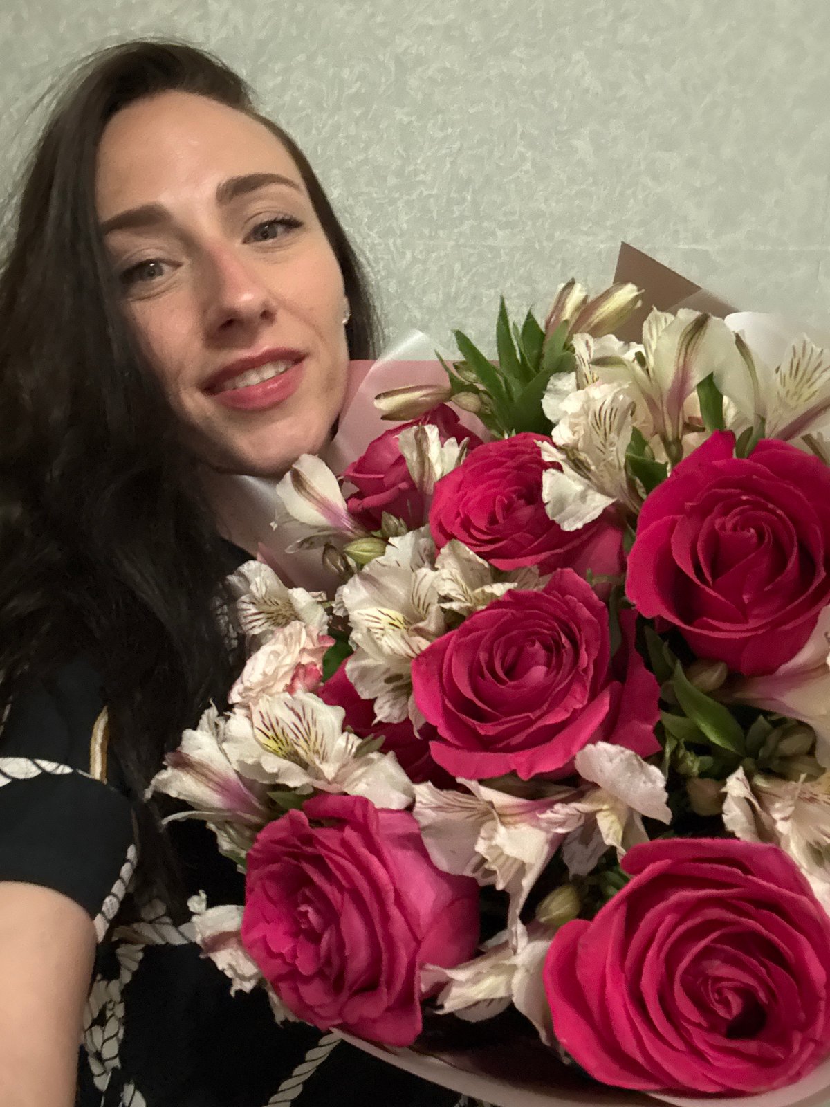 Woman poses with flower bouquets across Saint Petersburg locations
