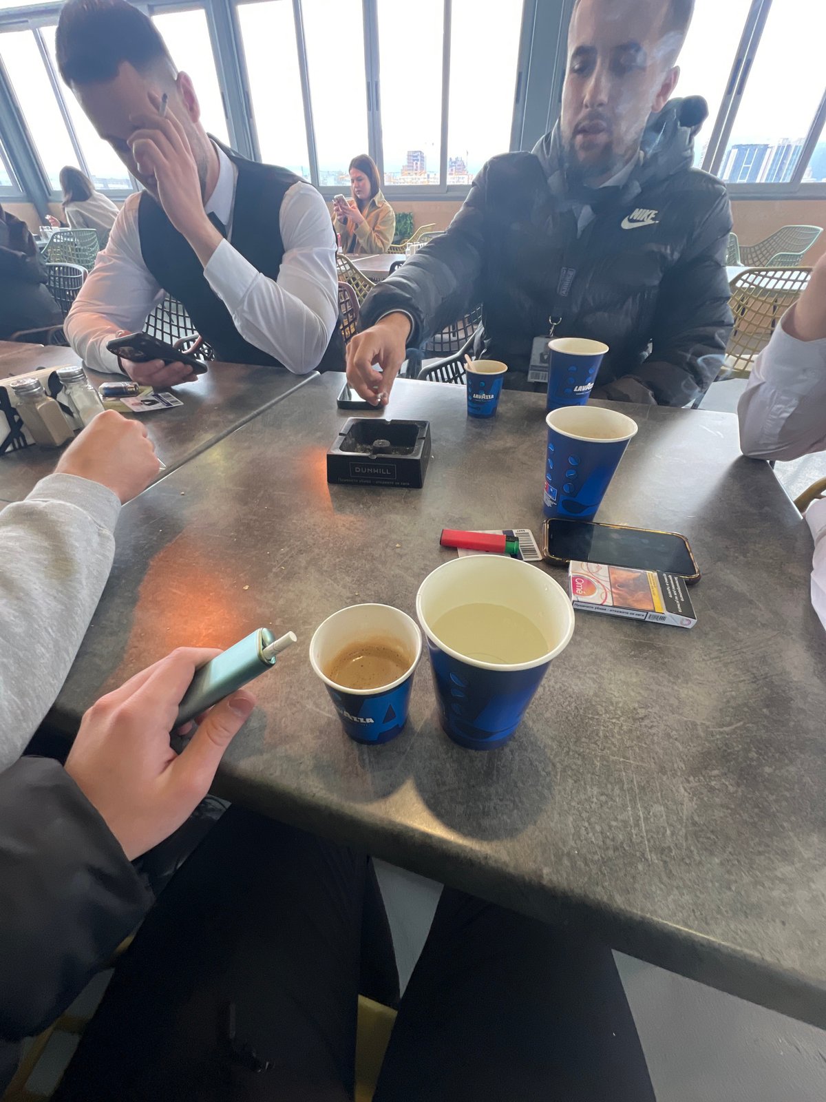 Coffee gathering at Sofia cafe with cigarettes and conversation
