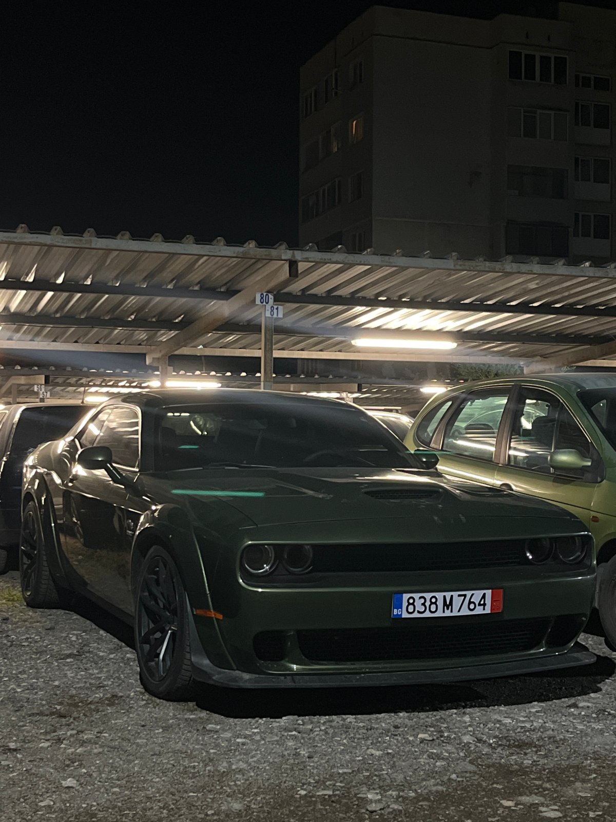 Green Dodge Challenger documented in Sofia parking garage