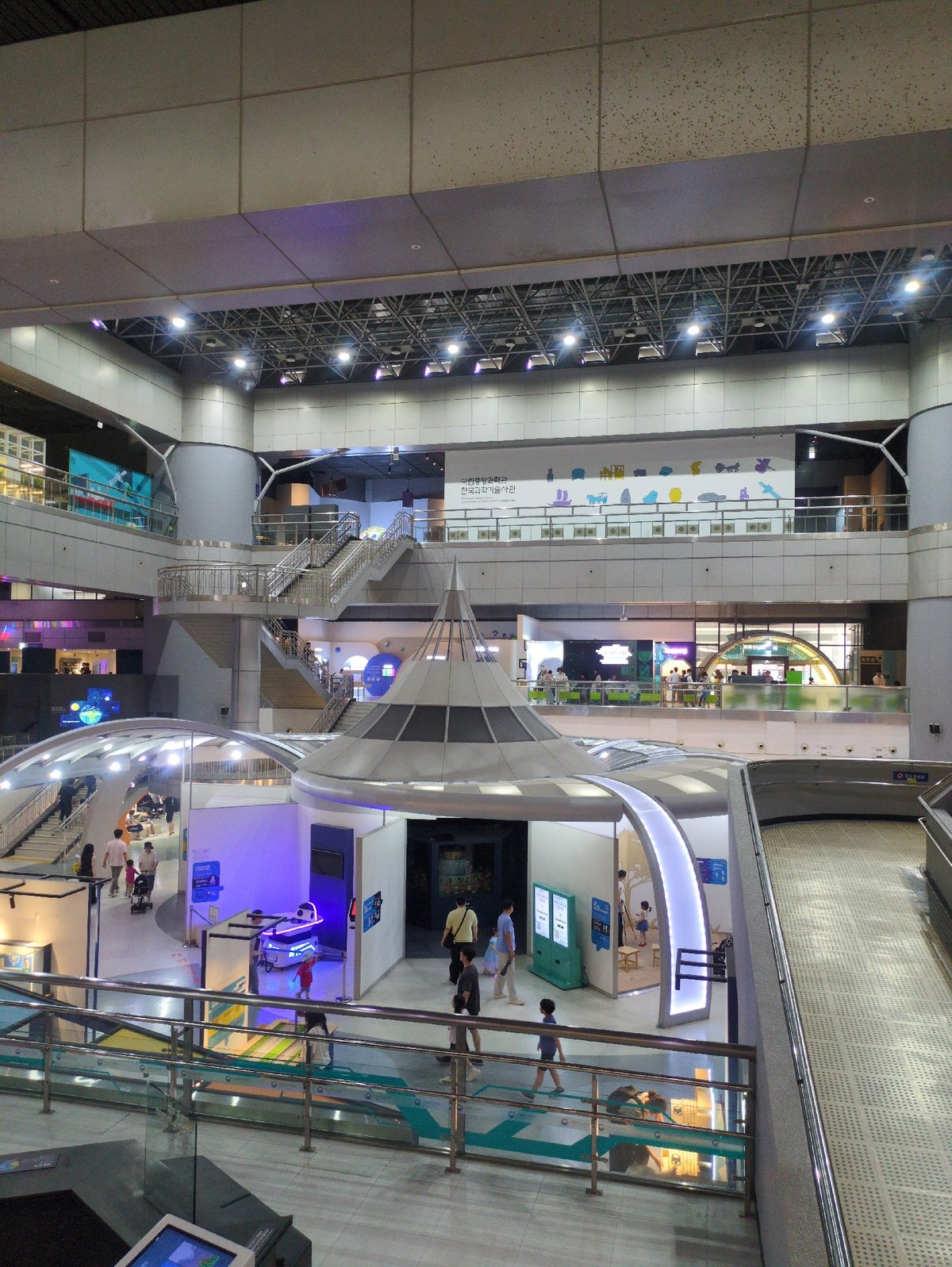 Visitor documents science museum exhibits in Daejeon, South Korea
