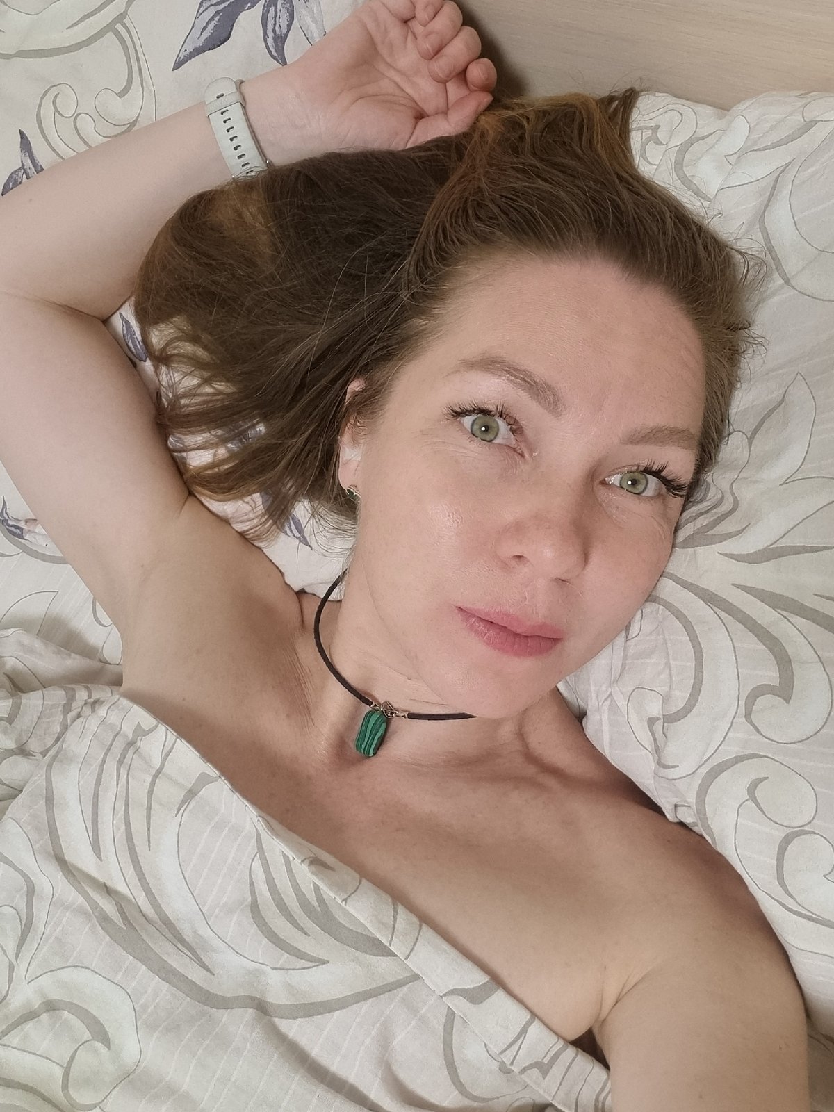 Woman and tabby cat share quiet evening moments in Chaikovsky