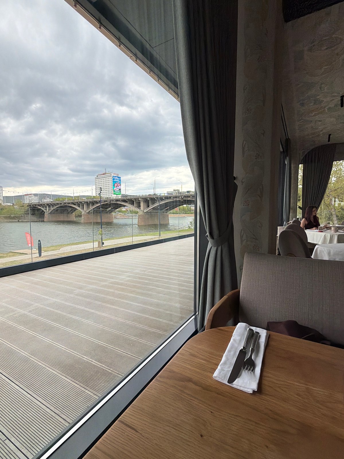 Morning dining session documented at Krasnoyarsk riverside restaurant