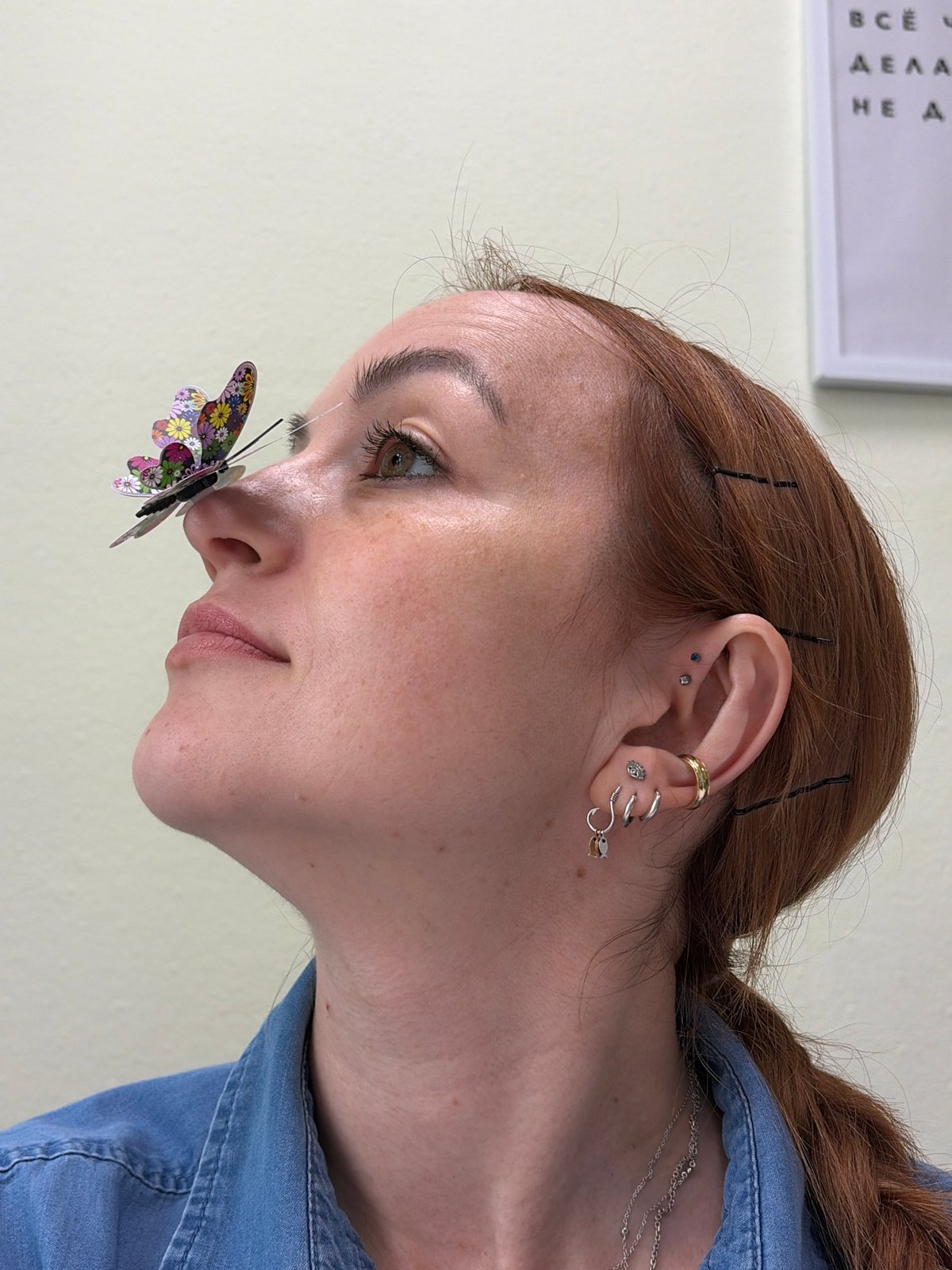 Woman takes selfies with butterfly decoration in Chaikovsky