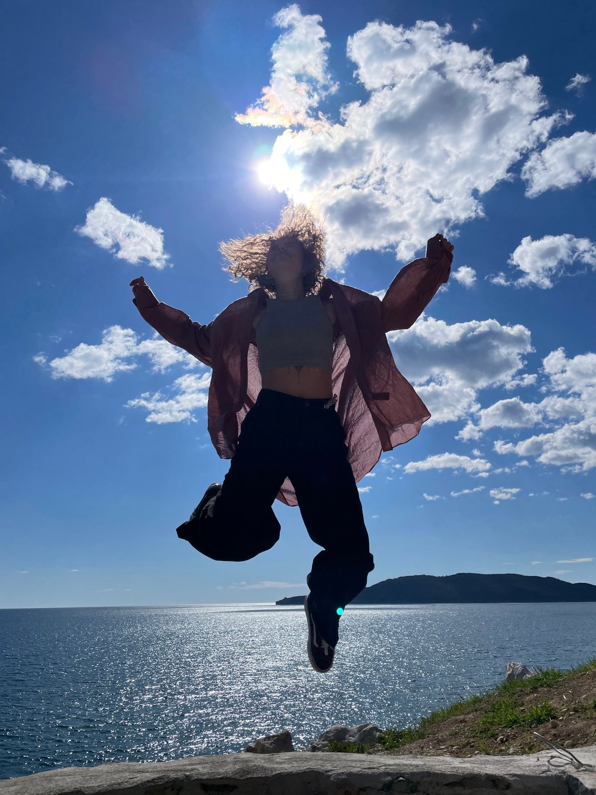Woman enjoys casual beach visit at Montenegro's Kamenovo coast