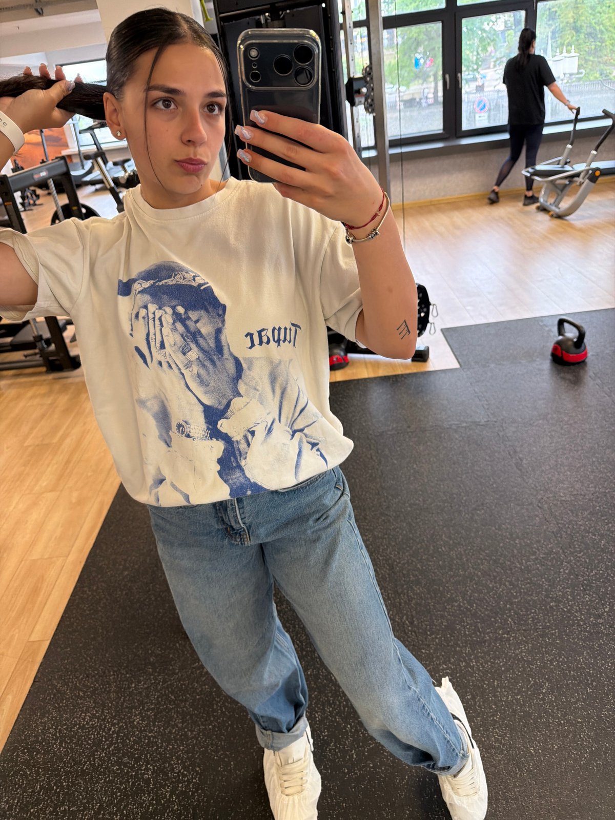Woman takes gym mirror selfies in Gabrovo, Bulgaria