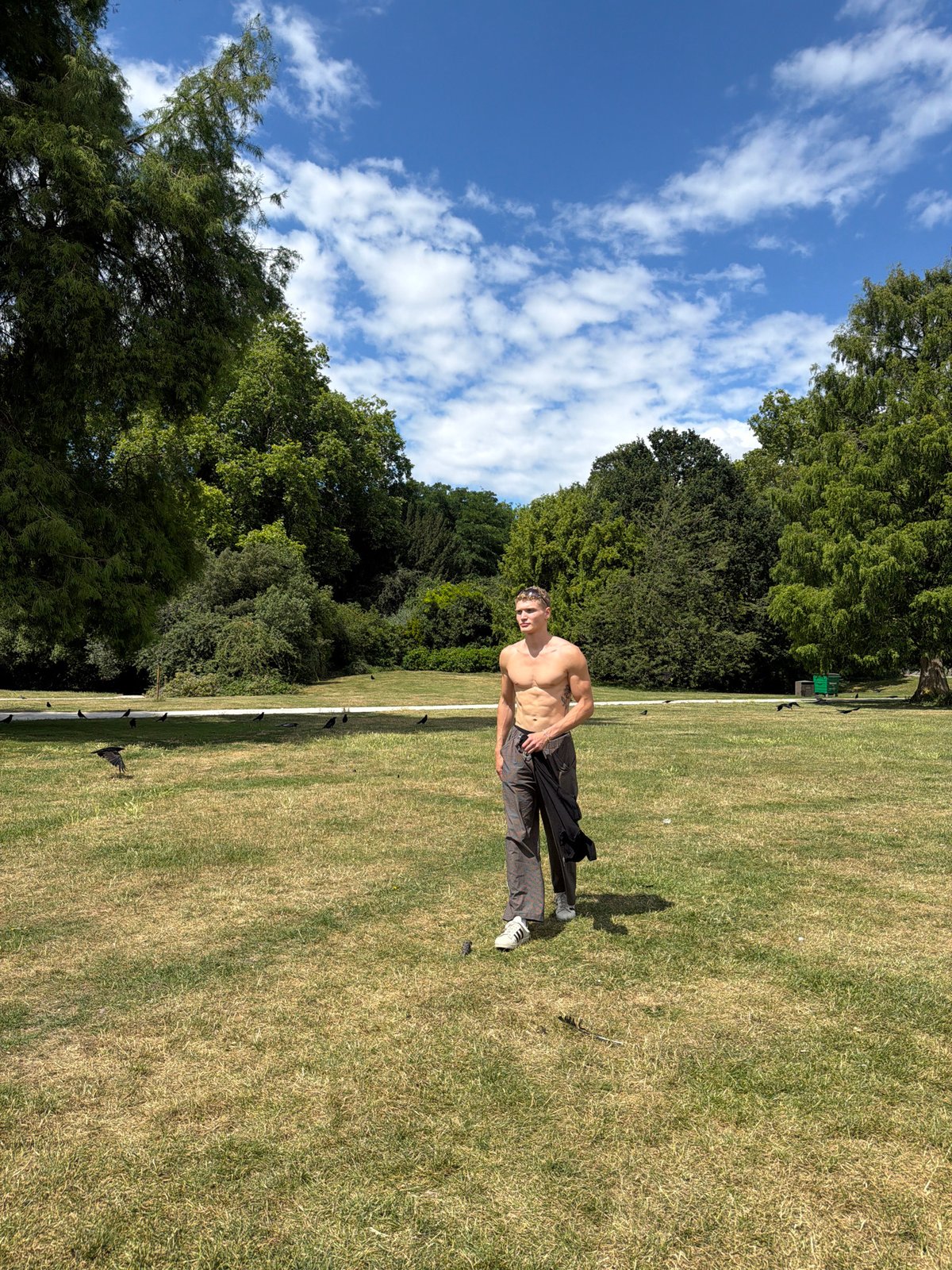 Strolling across a sunny London field on a warm afternoon