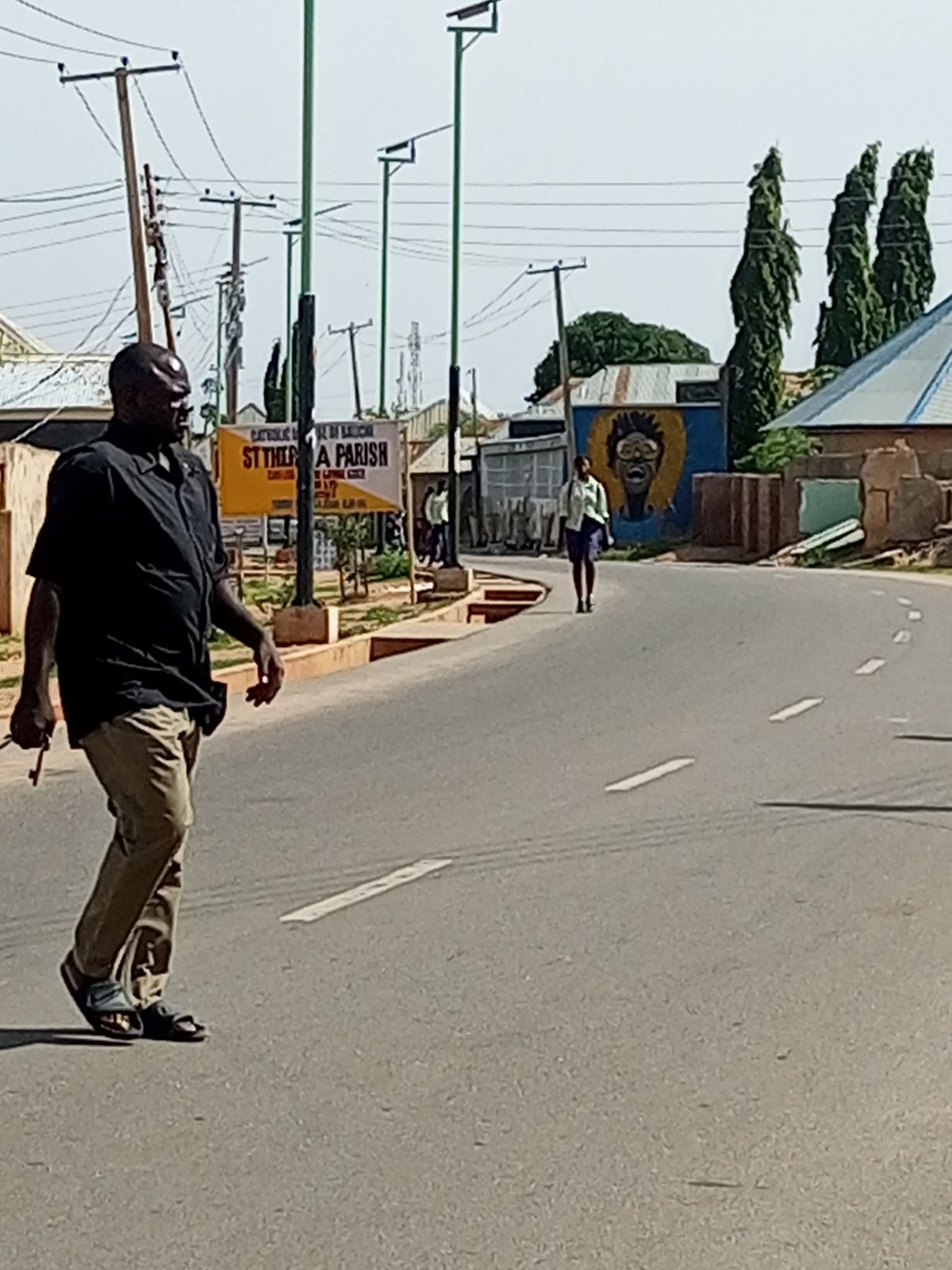Morning street life and motorcycle traffic in Gombe, Nigeria