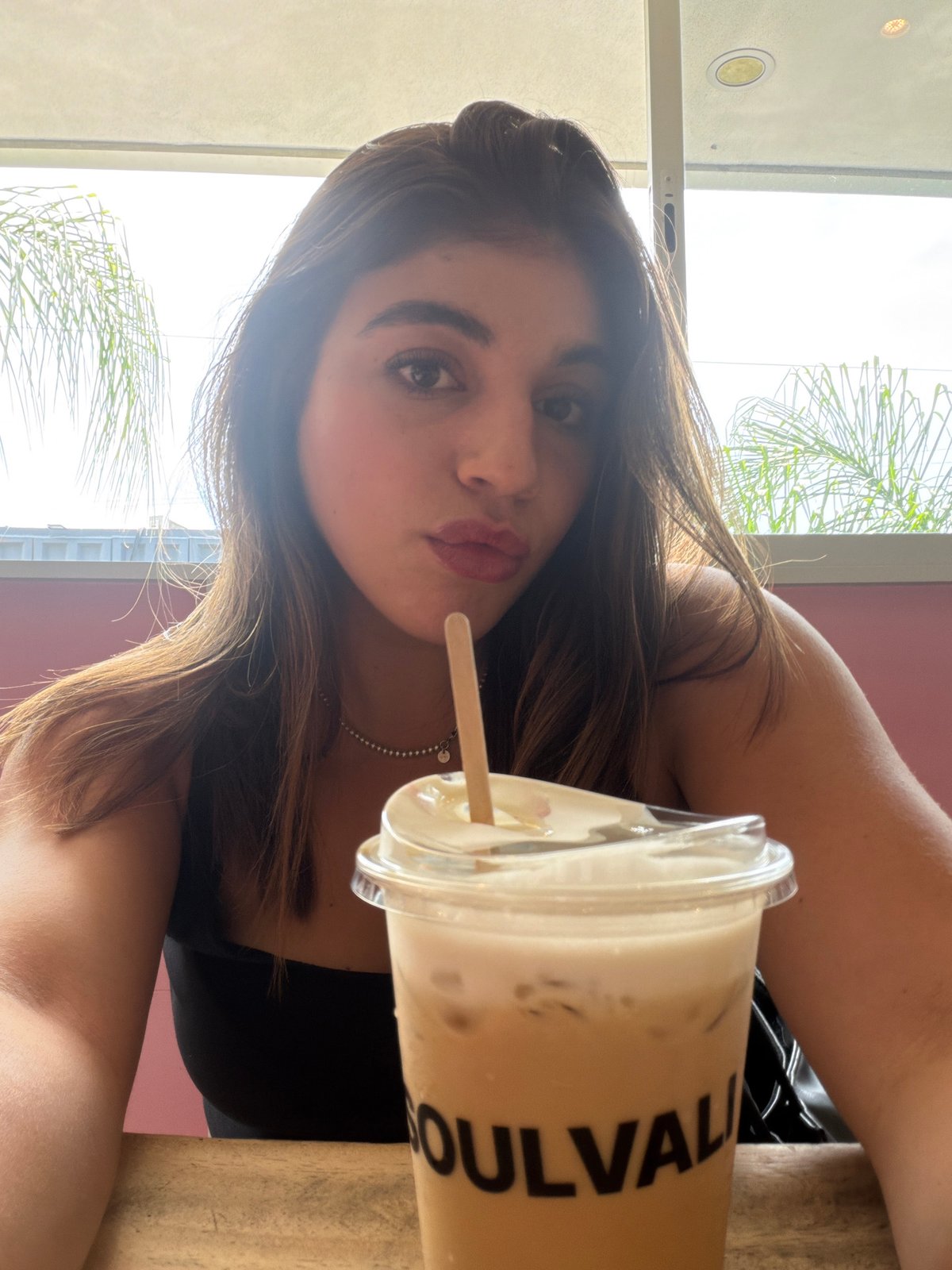 Woman documents café visit with friends in Puebla