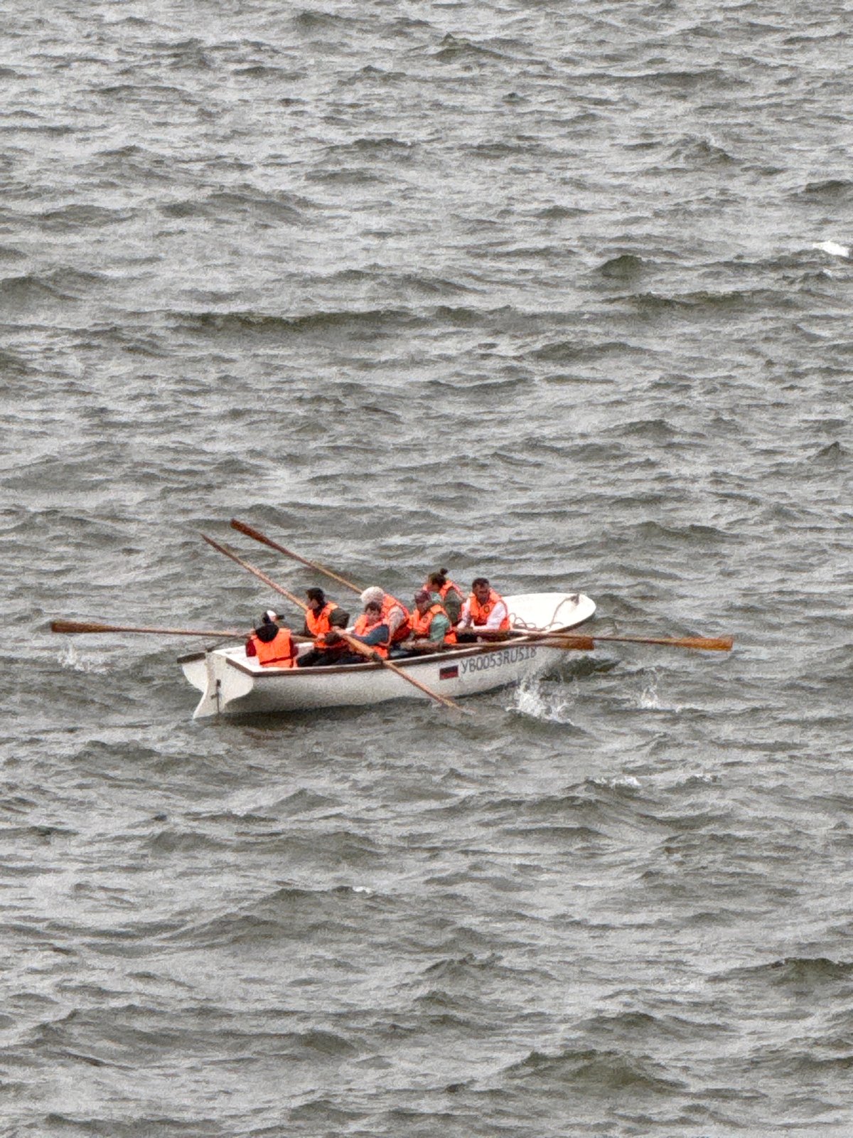 Rowing crews and small boats on a choppy Votkinsk lake