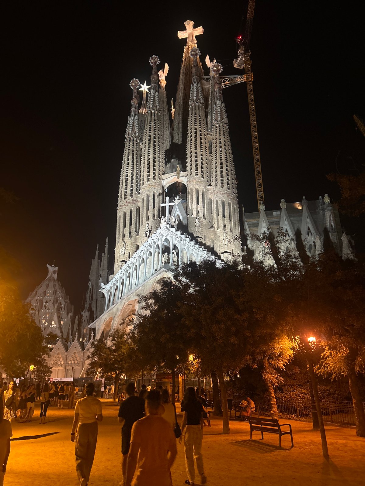 Barcelona at night: Sagrada Família and a glowing city arch
