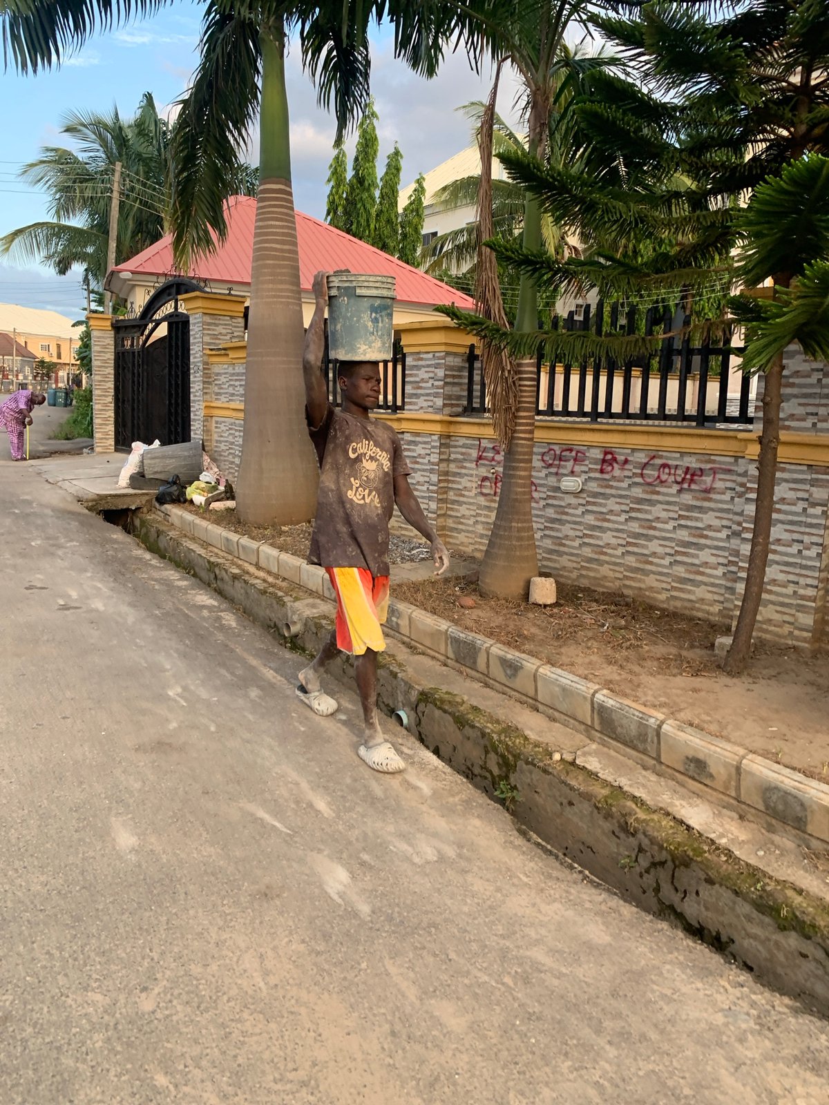 Afternoon street life captured across Abuja residential neighborhoods