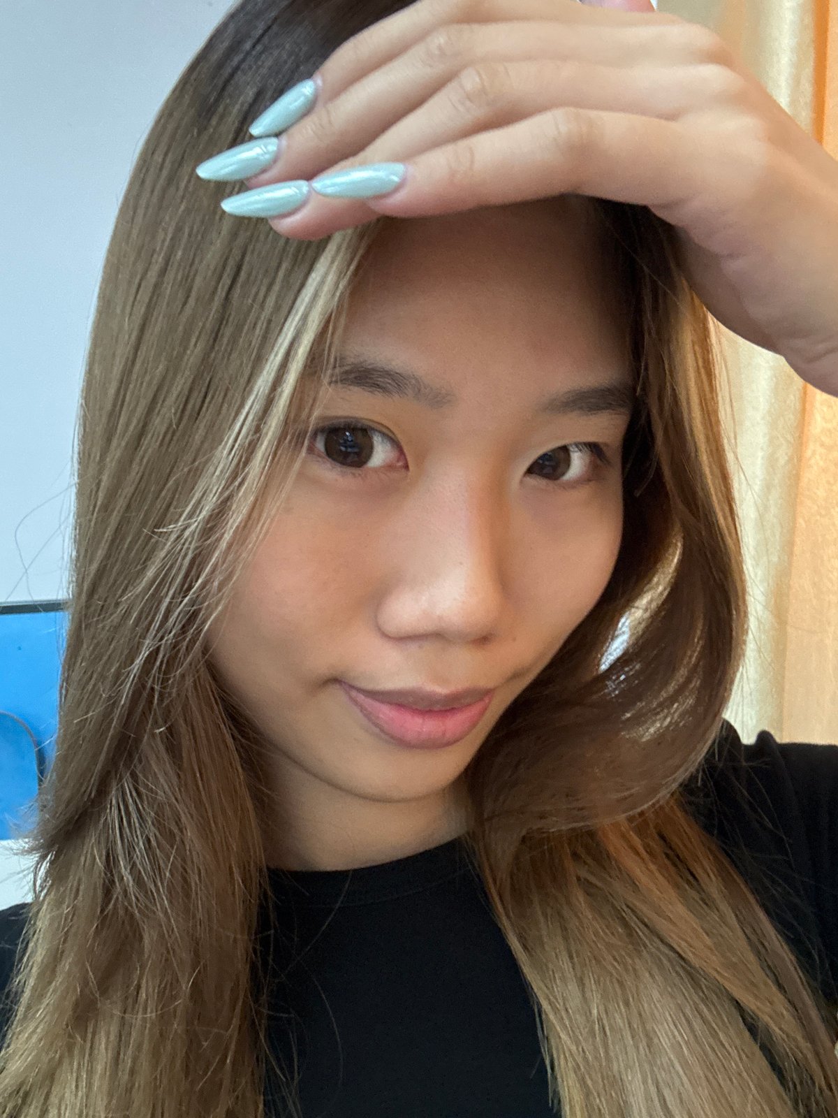 Portrait of young woman with two-toned hair captured in Nan'an