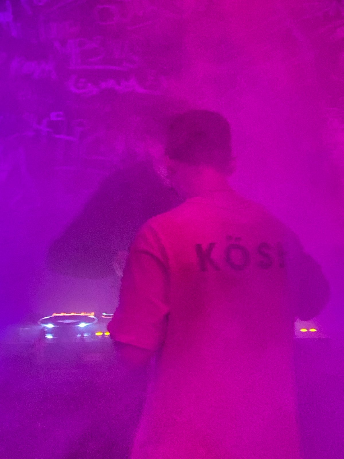 DJ performs at nightclub in Шебунино, Russia amid colorful lighting