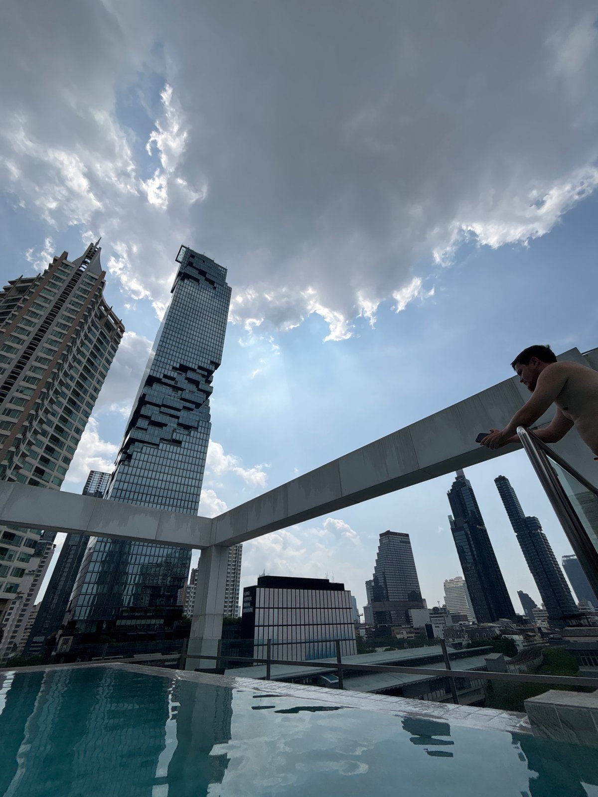 Morning snapshots capture routine Bangkok street life and rooftop leisure