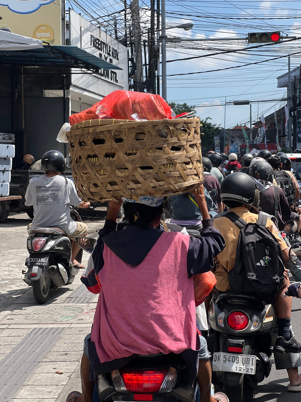 Heavy motorcycle traffic observed at Denpasar intersection