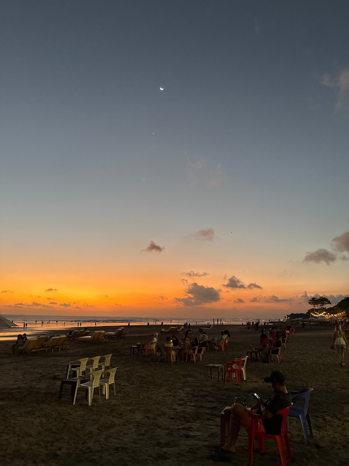 Kuta beach and streets wind down into a Bali evening