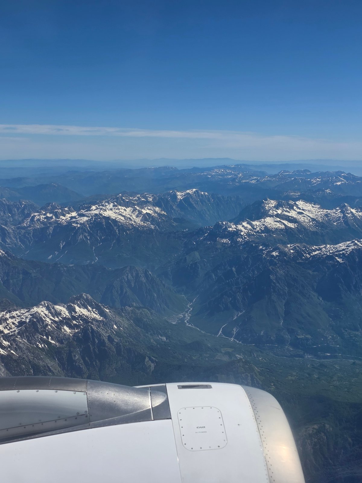 Passenger captures aerial view of Albanian mountains from aircraft