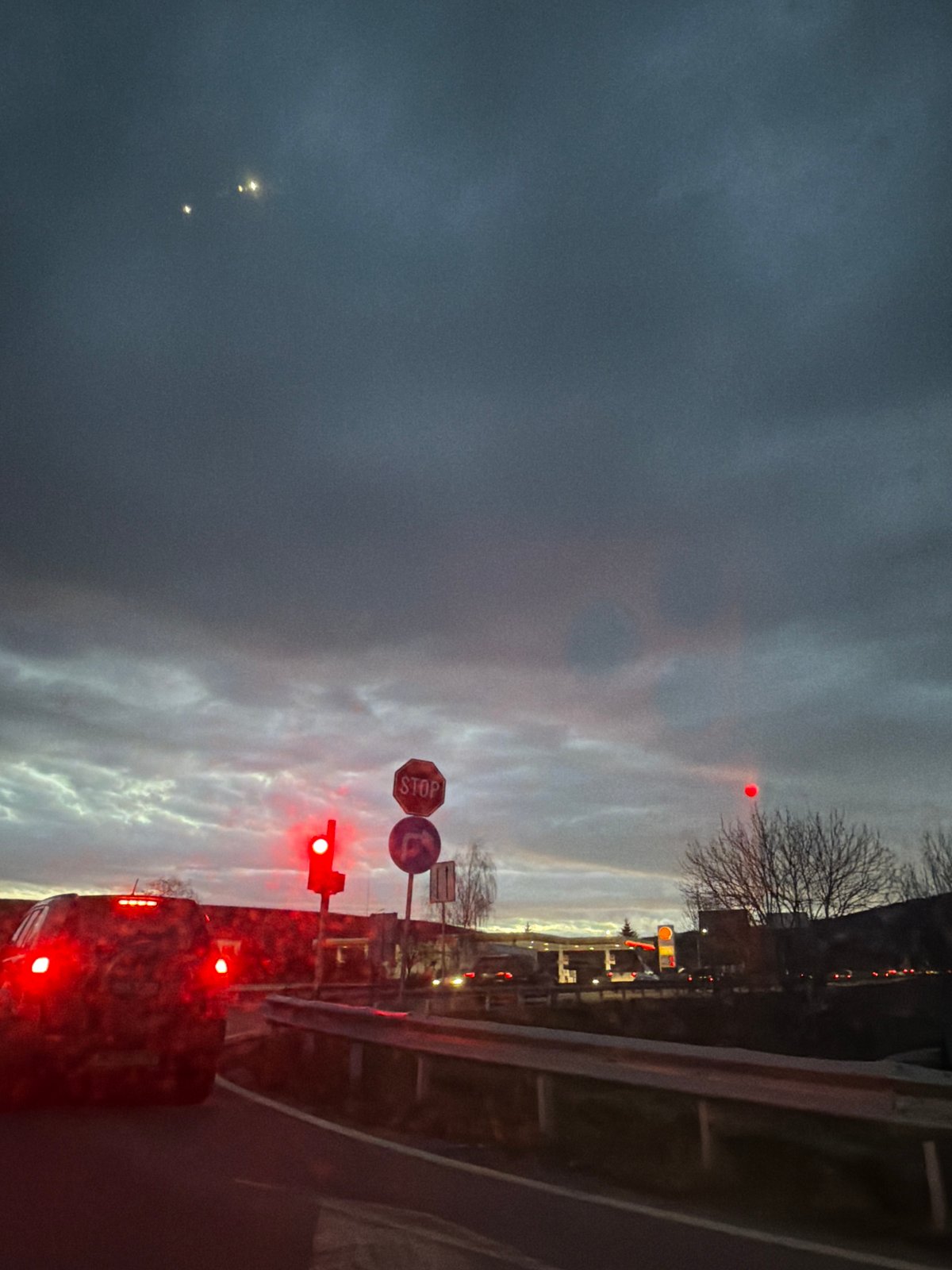 Early morning traffic navigates red light in Dragichevo