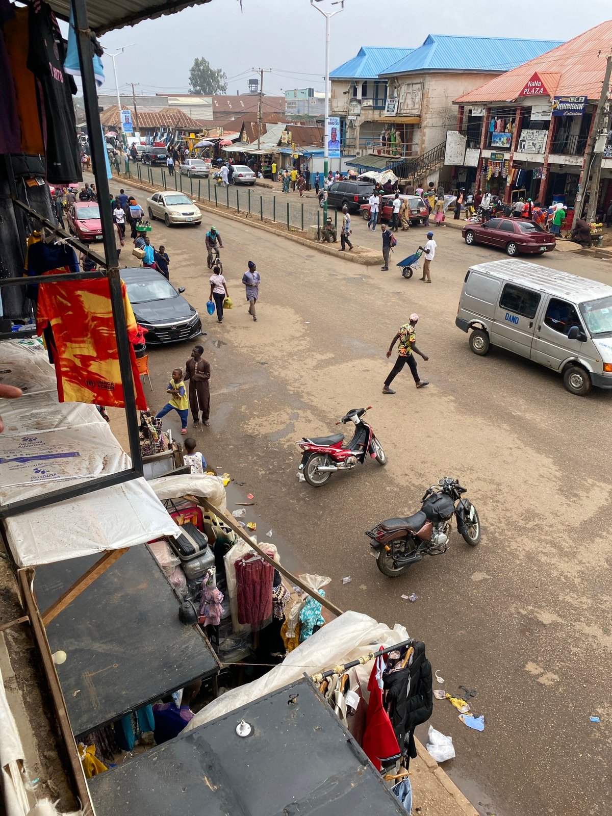 Street activity with police, vendors observed in Bukuru, Nigeria