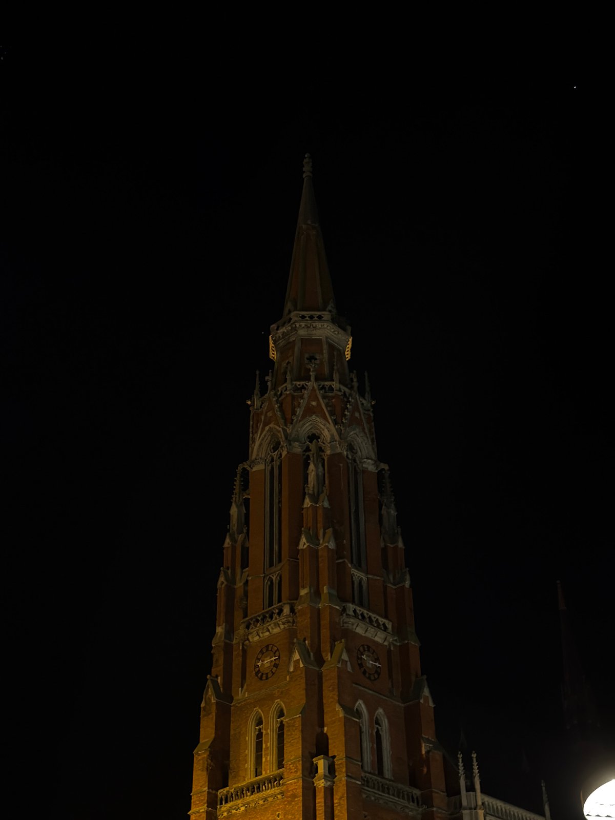 Nighttime photography session documents Osijek cathedral and historic buildings