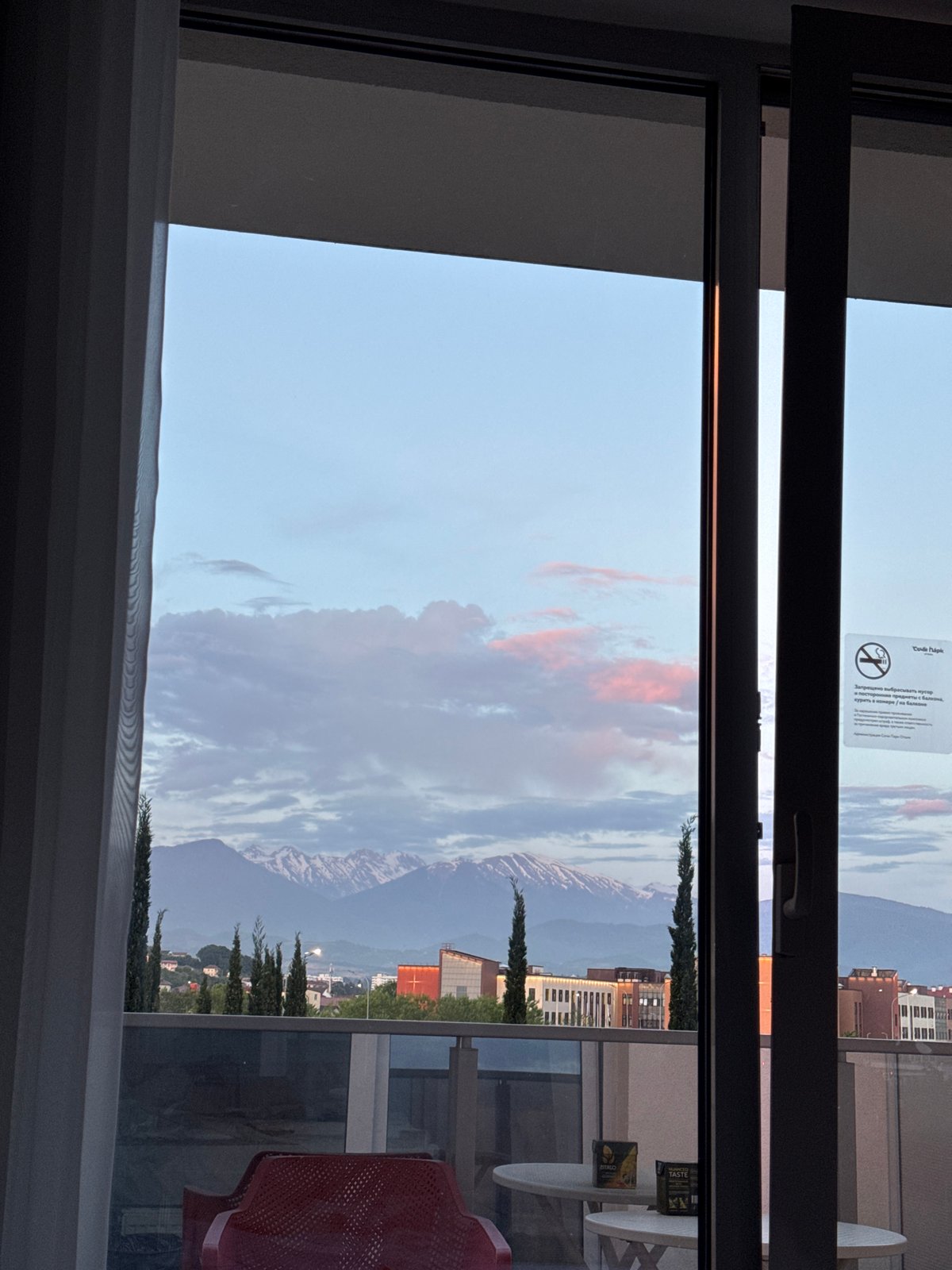 Sunset observed over Sochi mountains and cityscape
