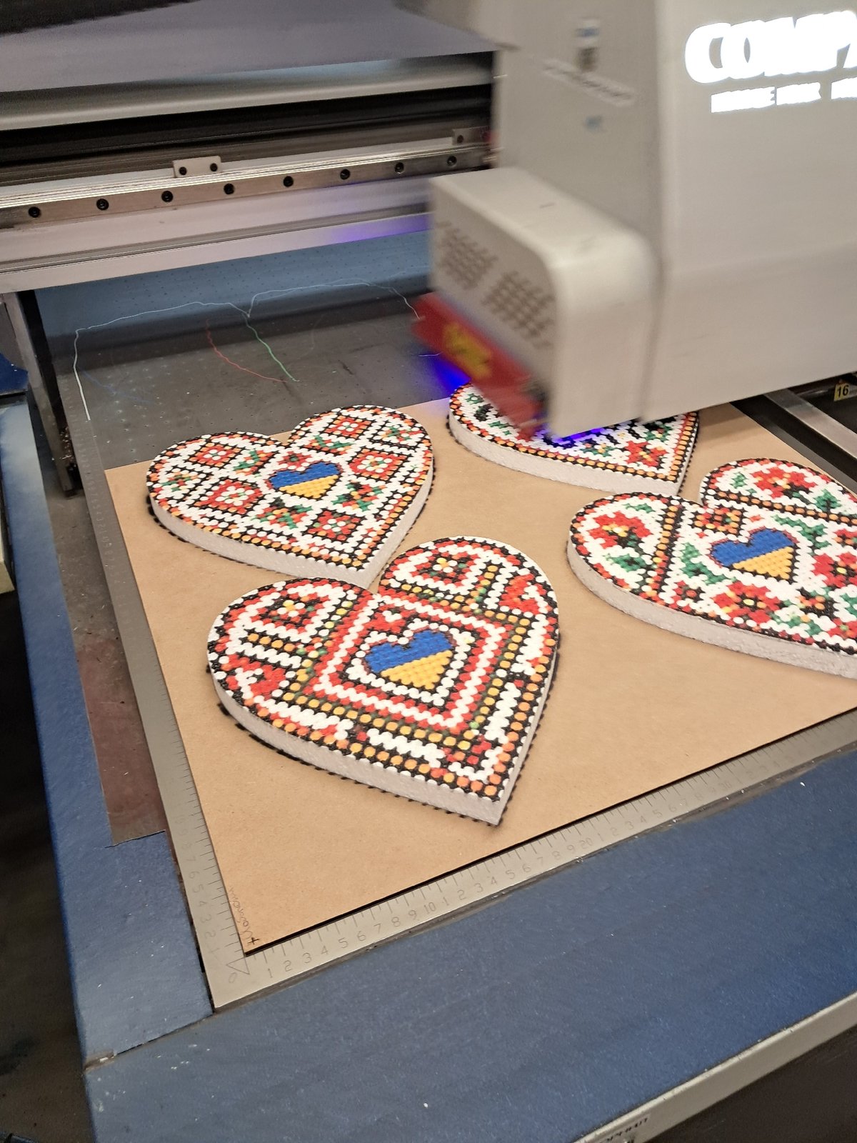 Warehouse walkthrough of laser-cut decorative cutouts and seasonal pieces