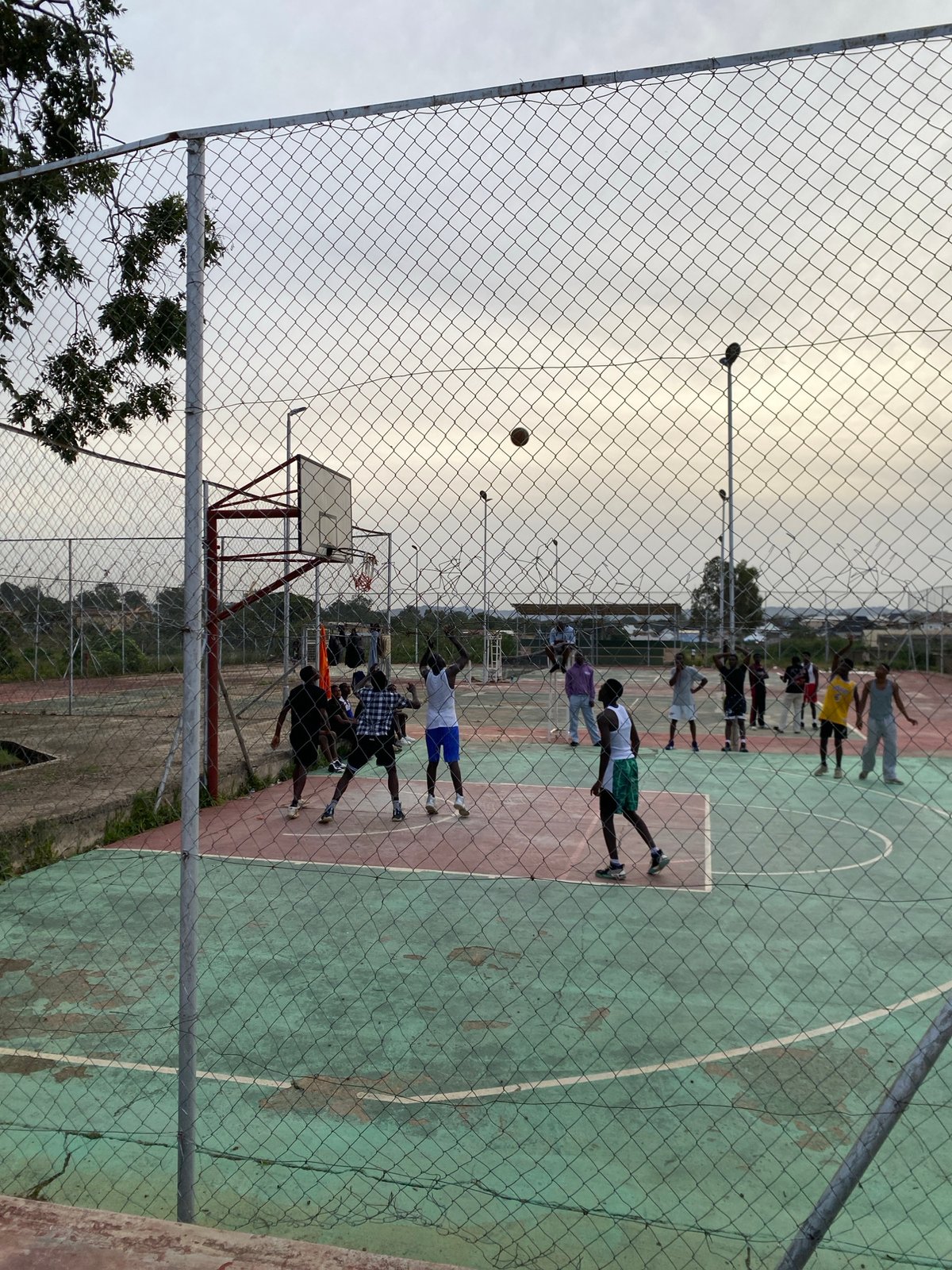 Basketball pickup game at an outdoor court in Jos, Nigeria