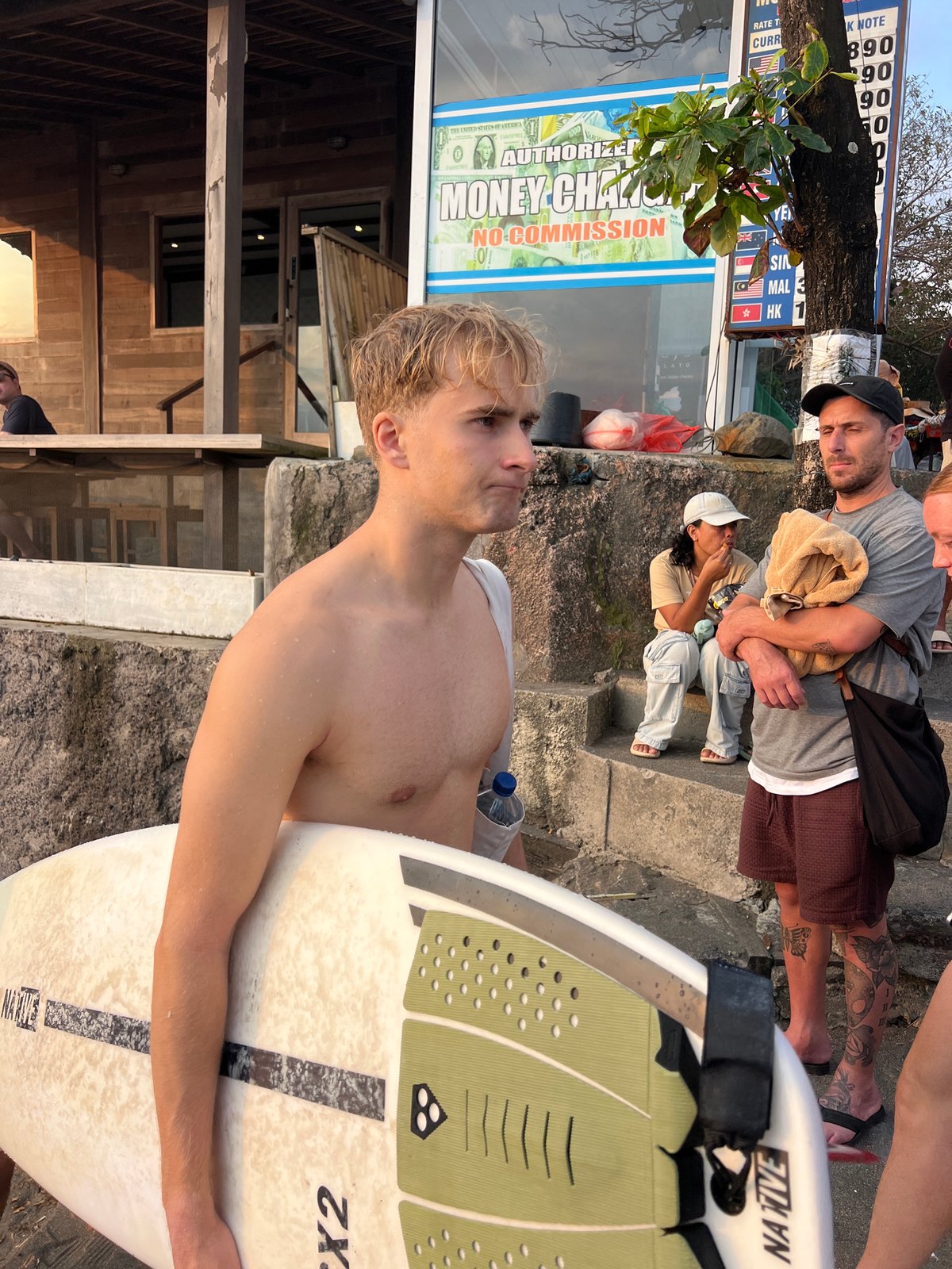 Golden hour crowd gathers at Kuta Beach for sunset and street food