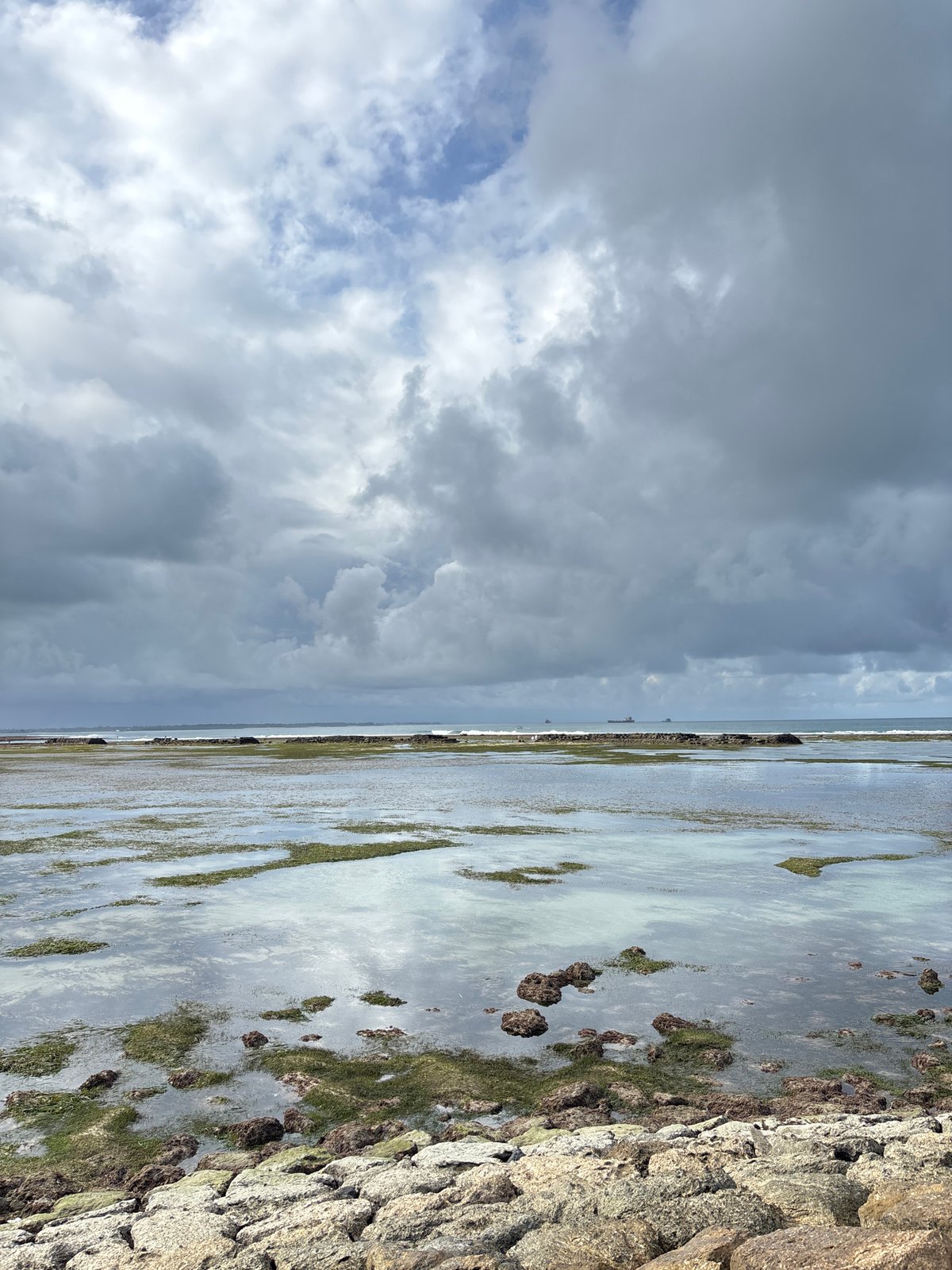 Coastal scene with dramatic clouds photographed in Kuta Selatan