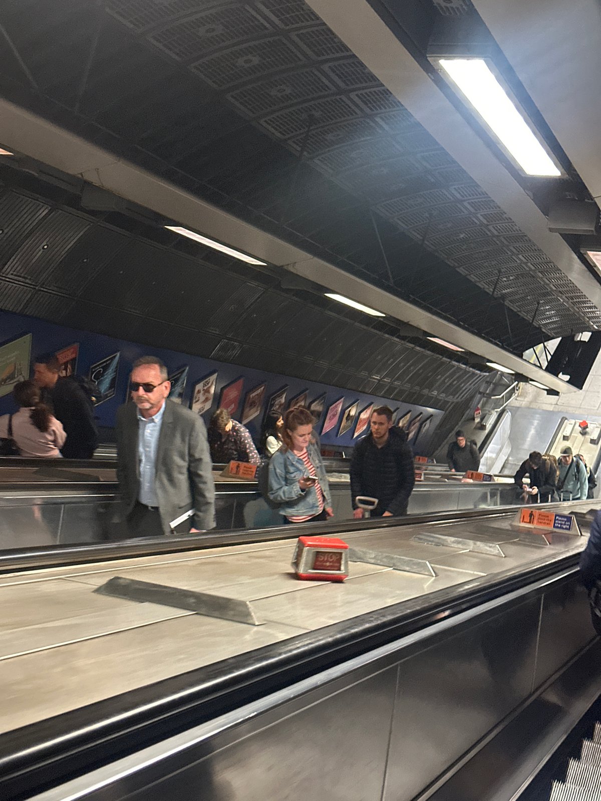 London Underground escalator captured from multiple angles during morning commute