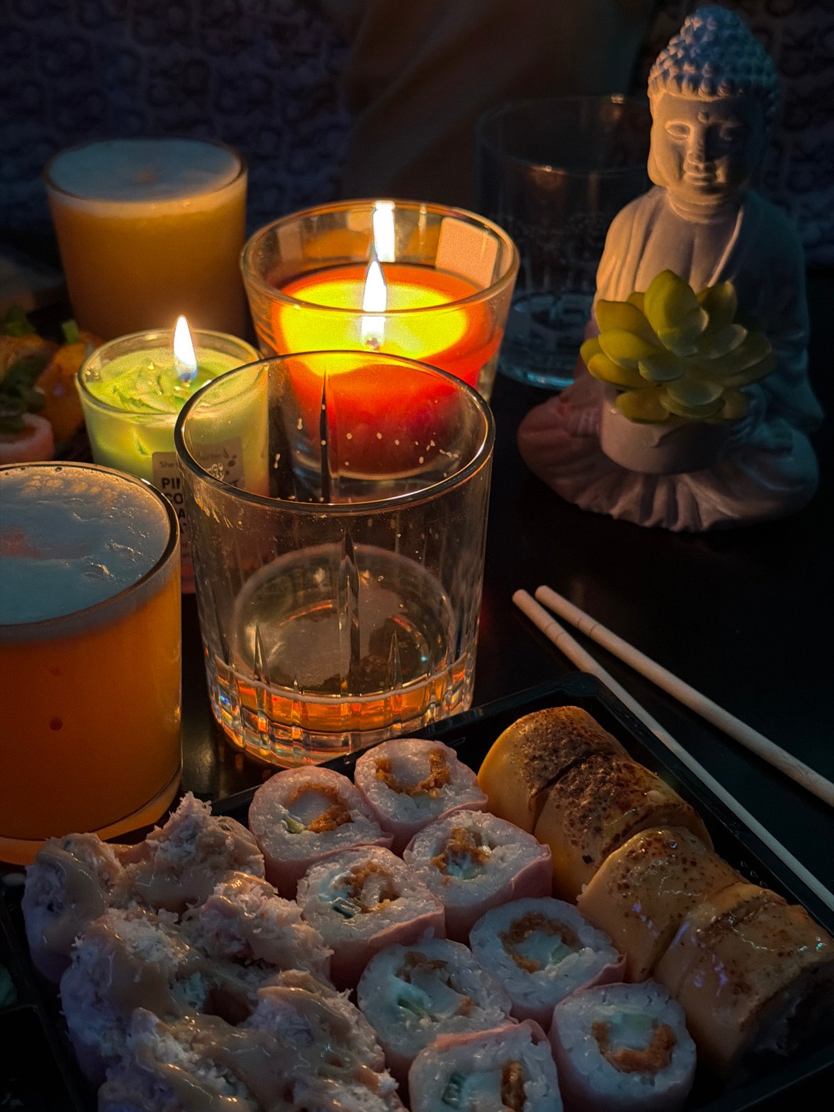 Cocktail preparation accompanies sushi dinner in candlelit Varna setting