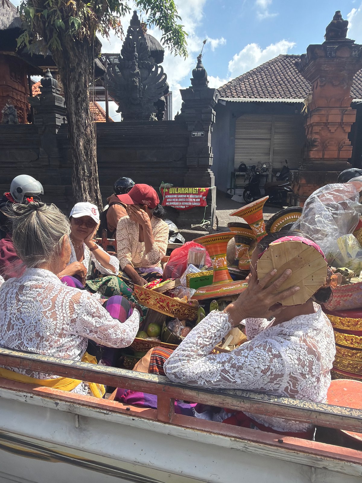 Traditional Balinese ceremonial procession moving through North Kuta
