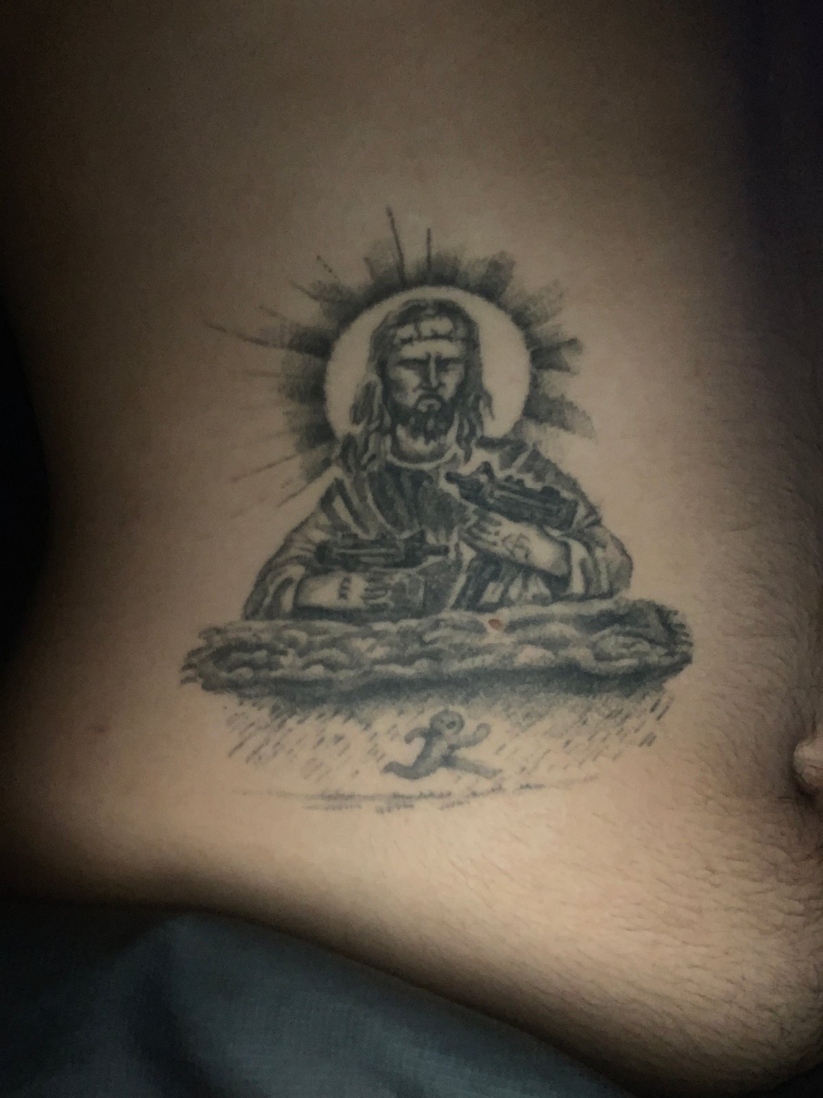 Religious tattoo featuring Christ figure documented in Buenos Aires