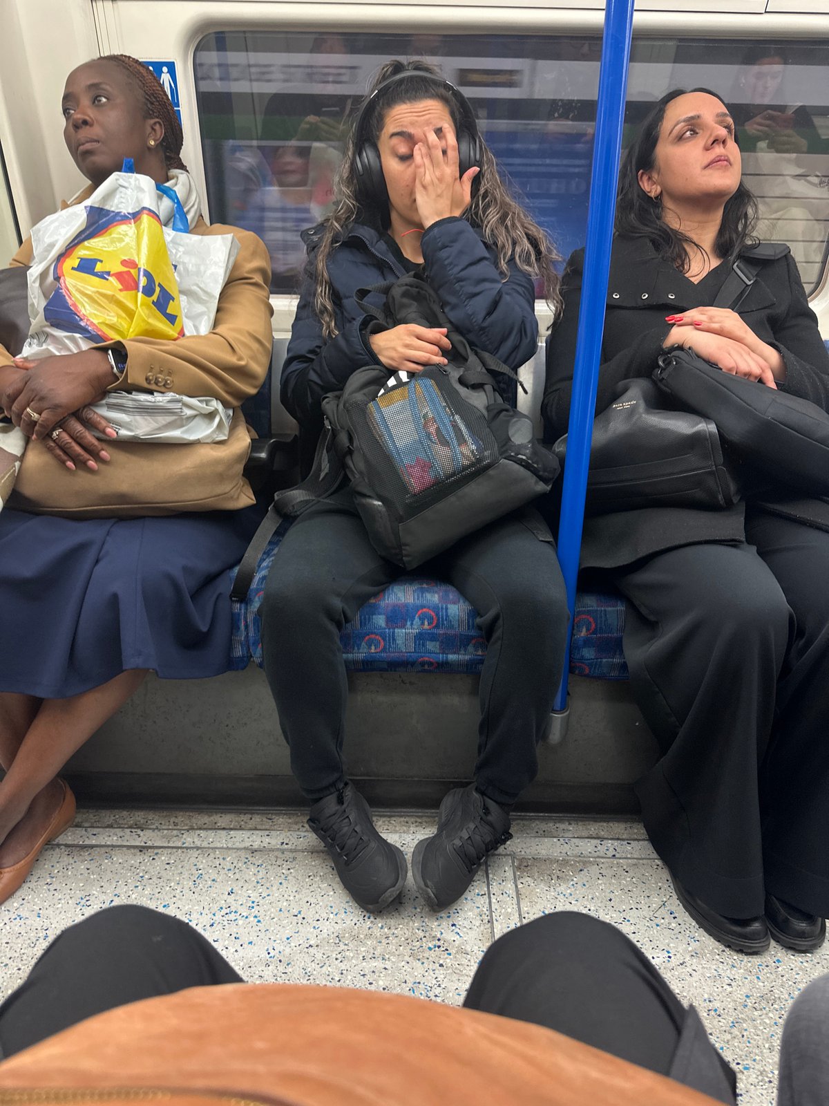 London scenes: Underground passengers and indoor art display observed
