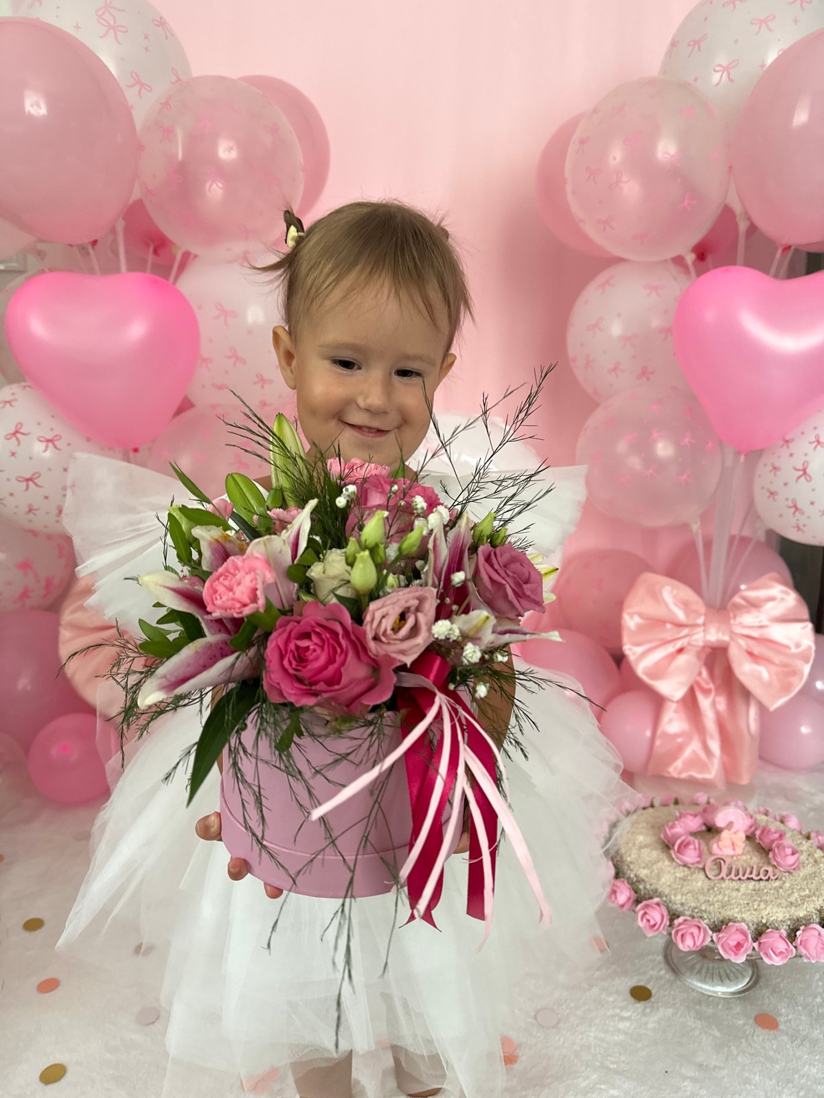 Pink flower box presented in a heartfelt indoor moment, Wisła
