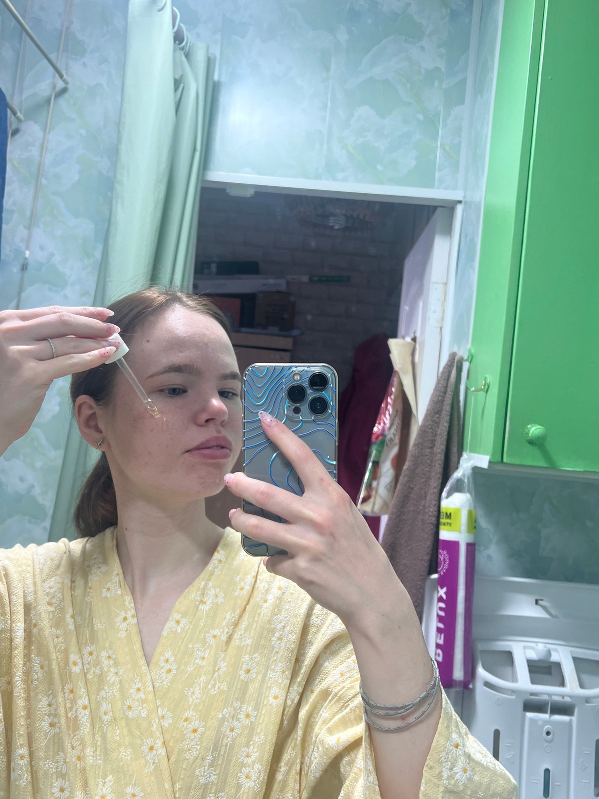 Woman documents early morning skincare routine in Russian bathroom