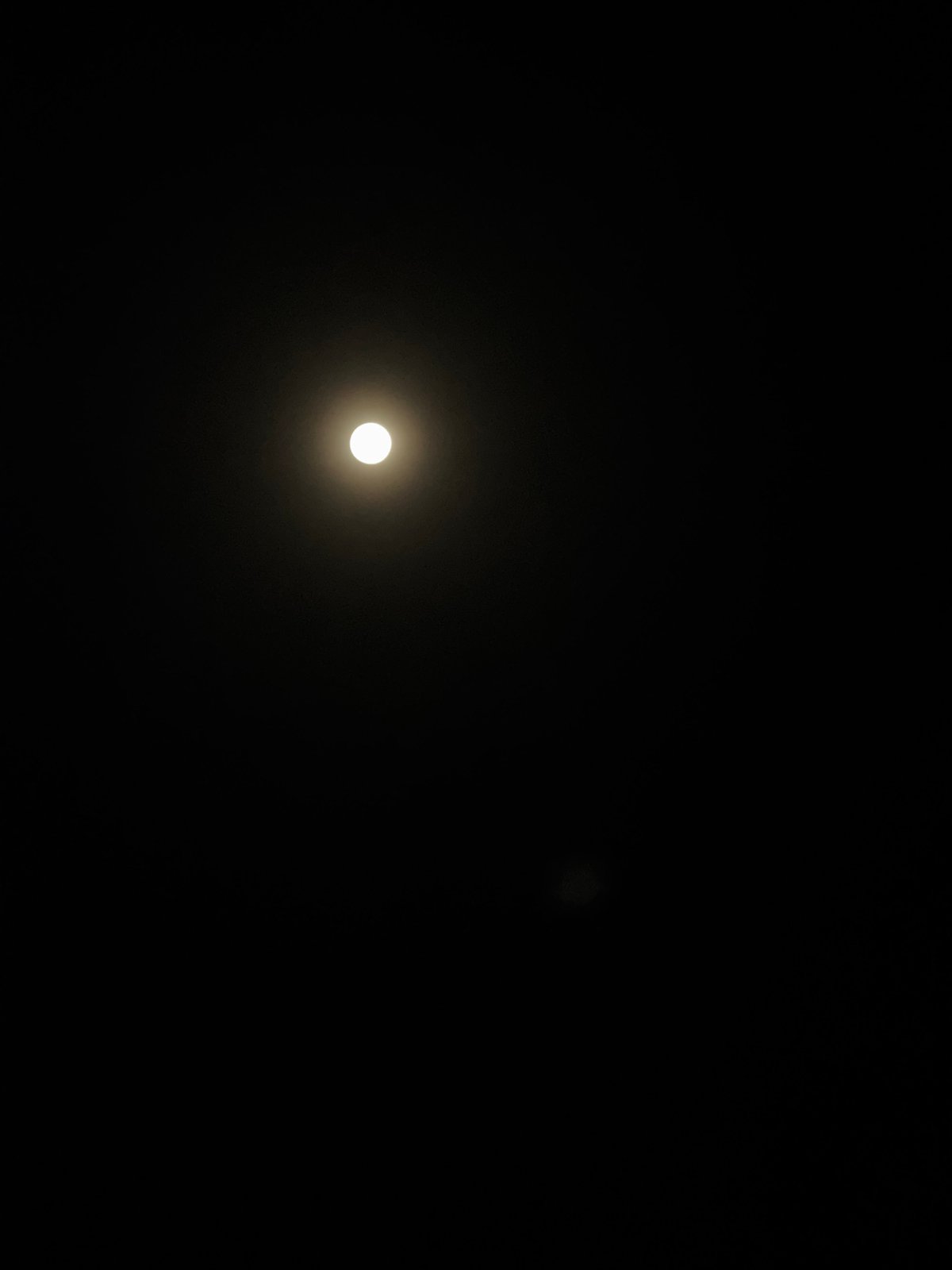 Witness observes moon and secondary object during nighttime scene