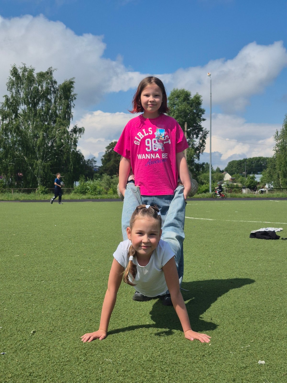 Family outing at sports field in Chaikovsky, Russia