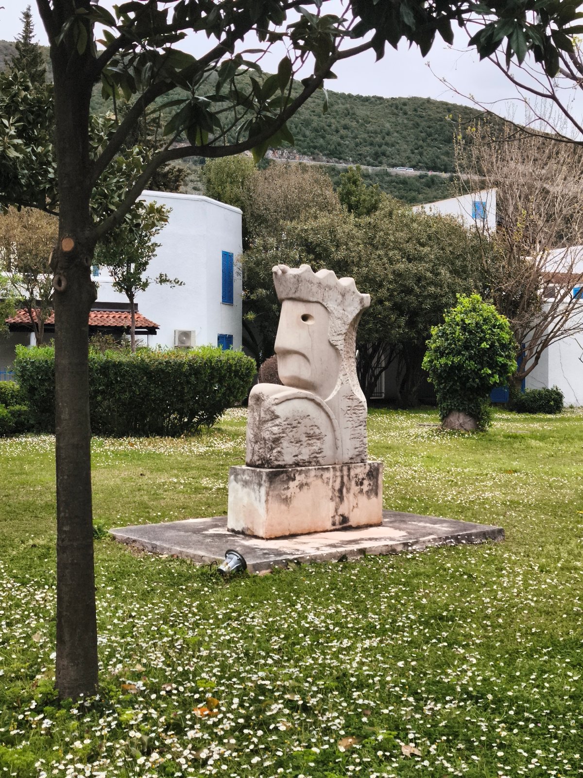 Stone sculpture and cats captured in Budva scenes