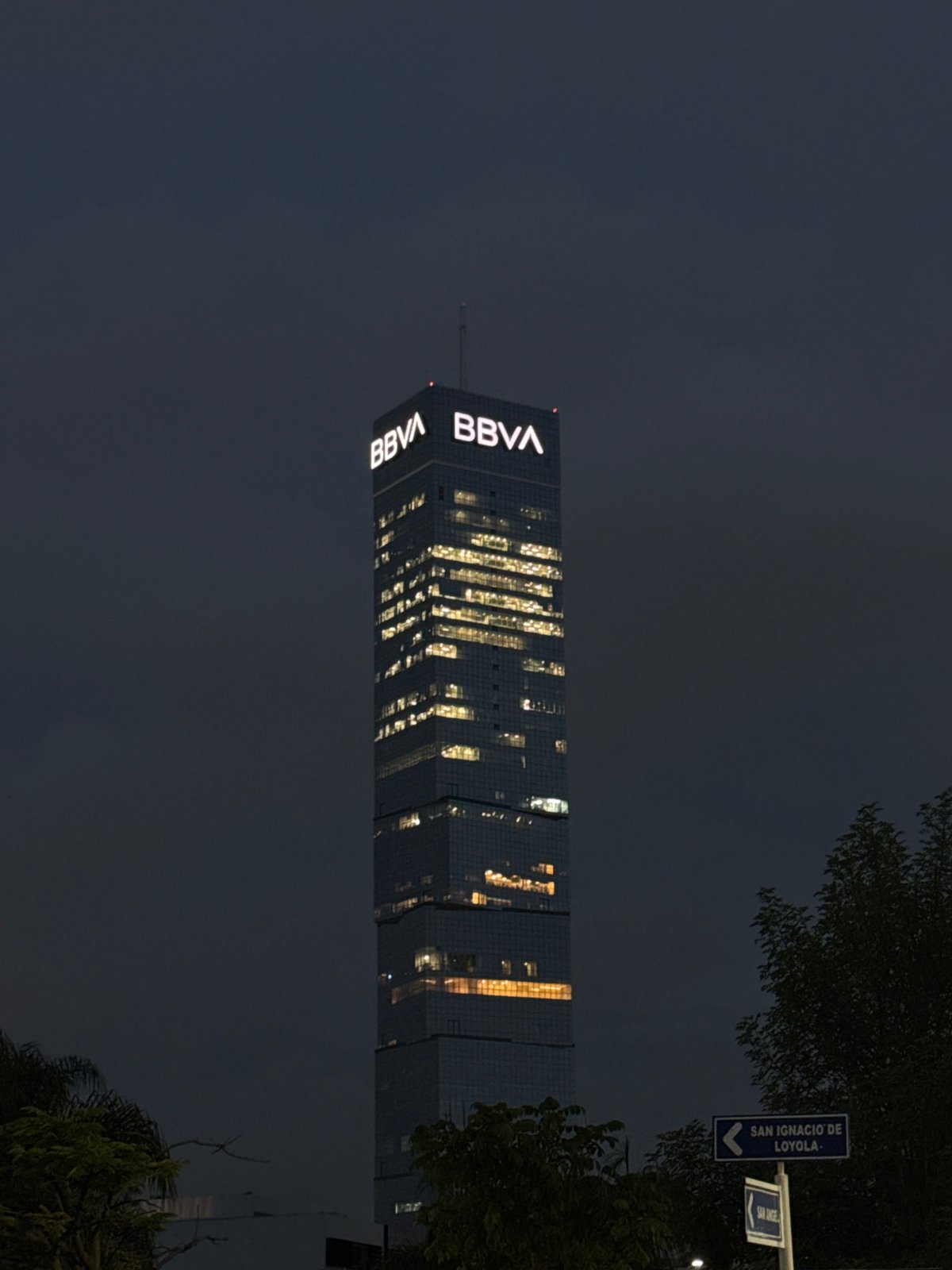 BBVA building illuminated at night in Tlaxcalancingo, Mexico