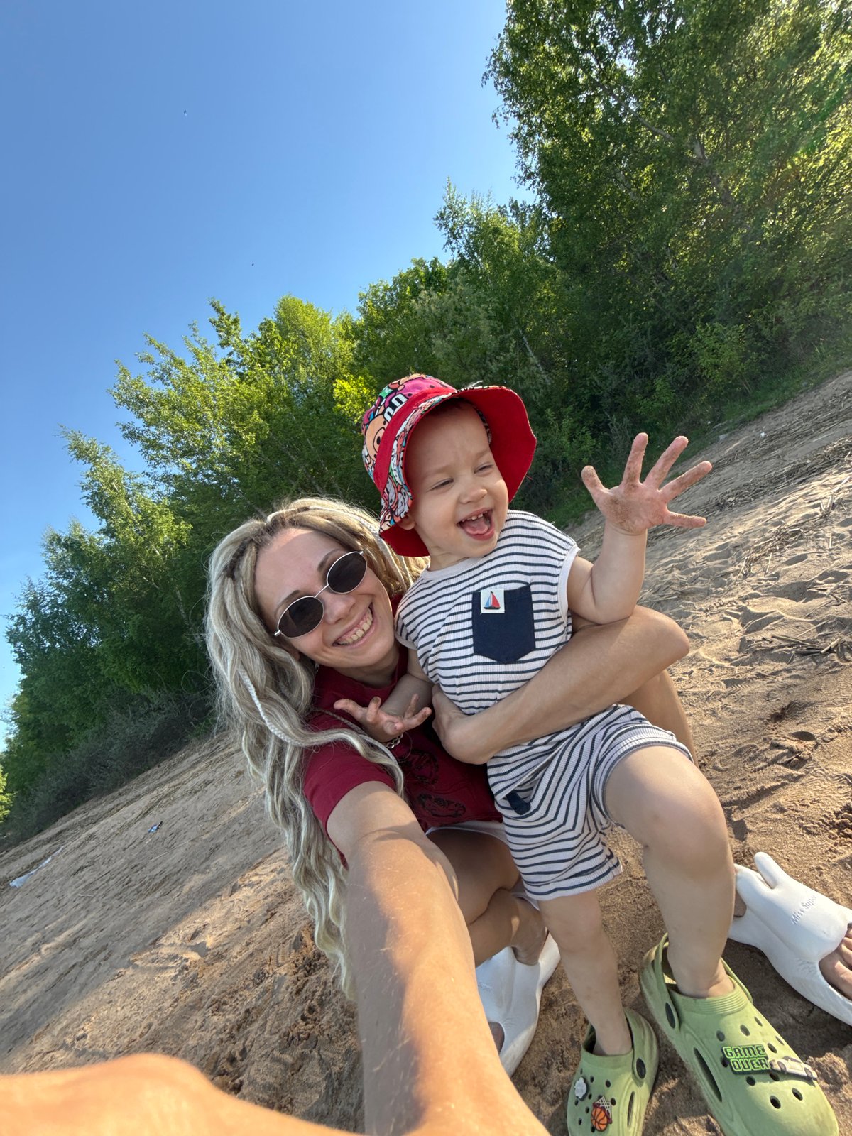 Mother and child enjoy beach time in Шебунино, Russia
