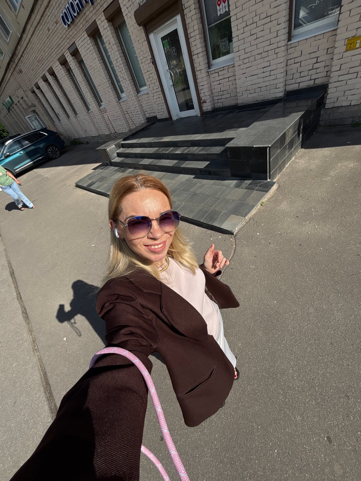 Selfie session outside a brick building in Sinyavino
