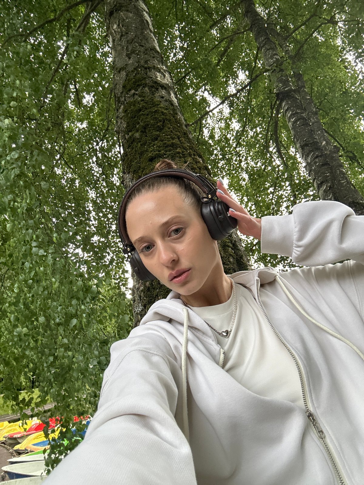 Quiet moment by a tree in Krasnogorsk, headphones on