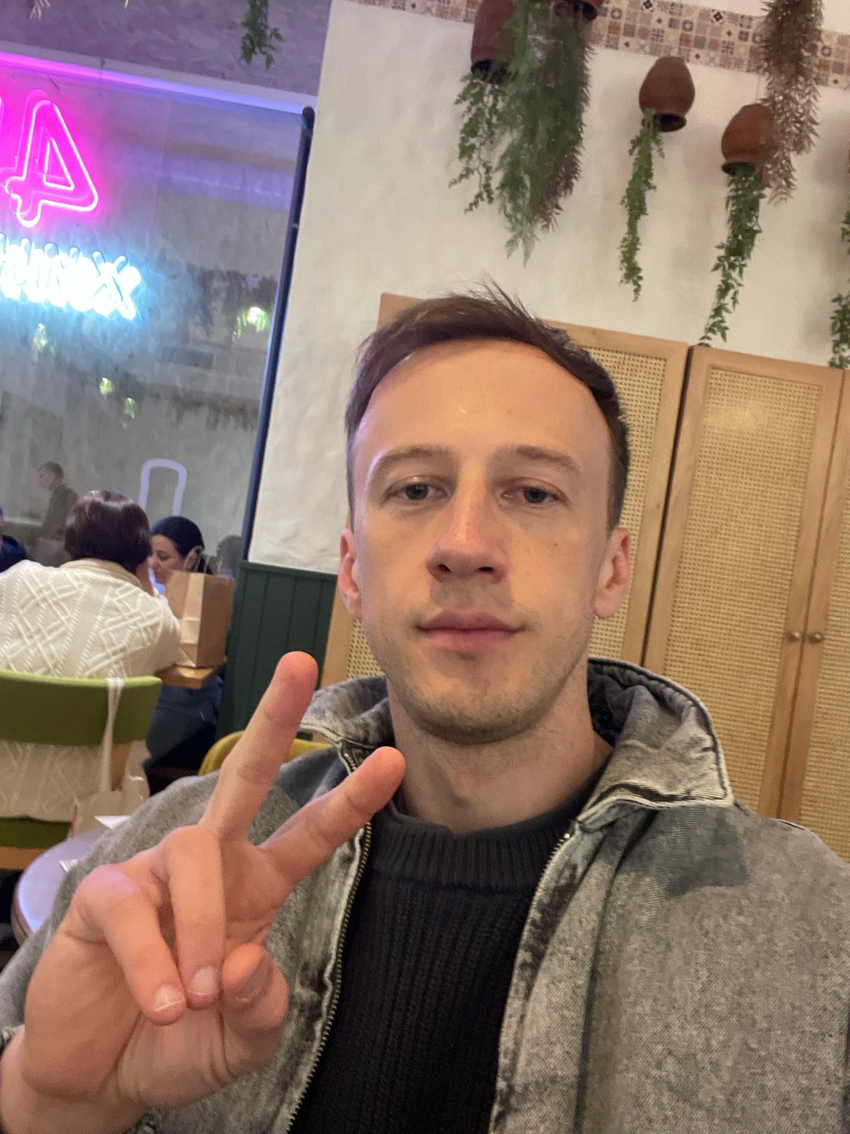 Man documented at restaurant and street in Saint Petersburg