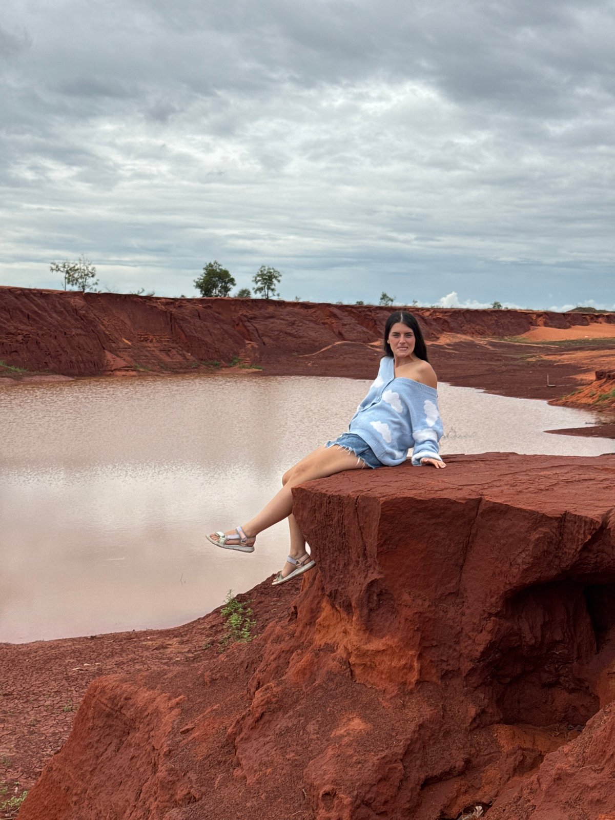 Tourist visits red rock formations at Mui Ne, Vietnam